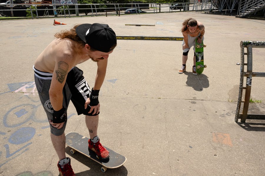 Skateboarders Anthony Eadens and Tommy Wright catch their breath after skating at the Dave Armstrong Extreme Park on Sunday, June 22, 2025, in Louisville, Ky. (AP Photo/Jon Cherry)