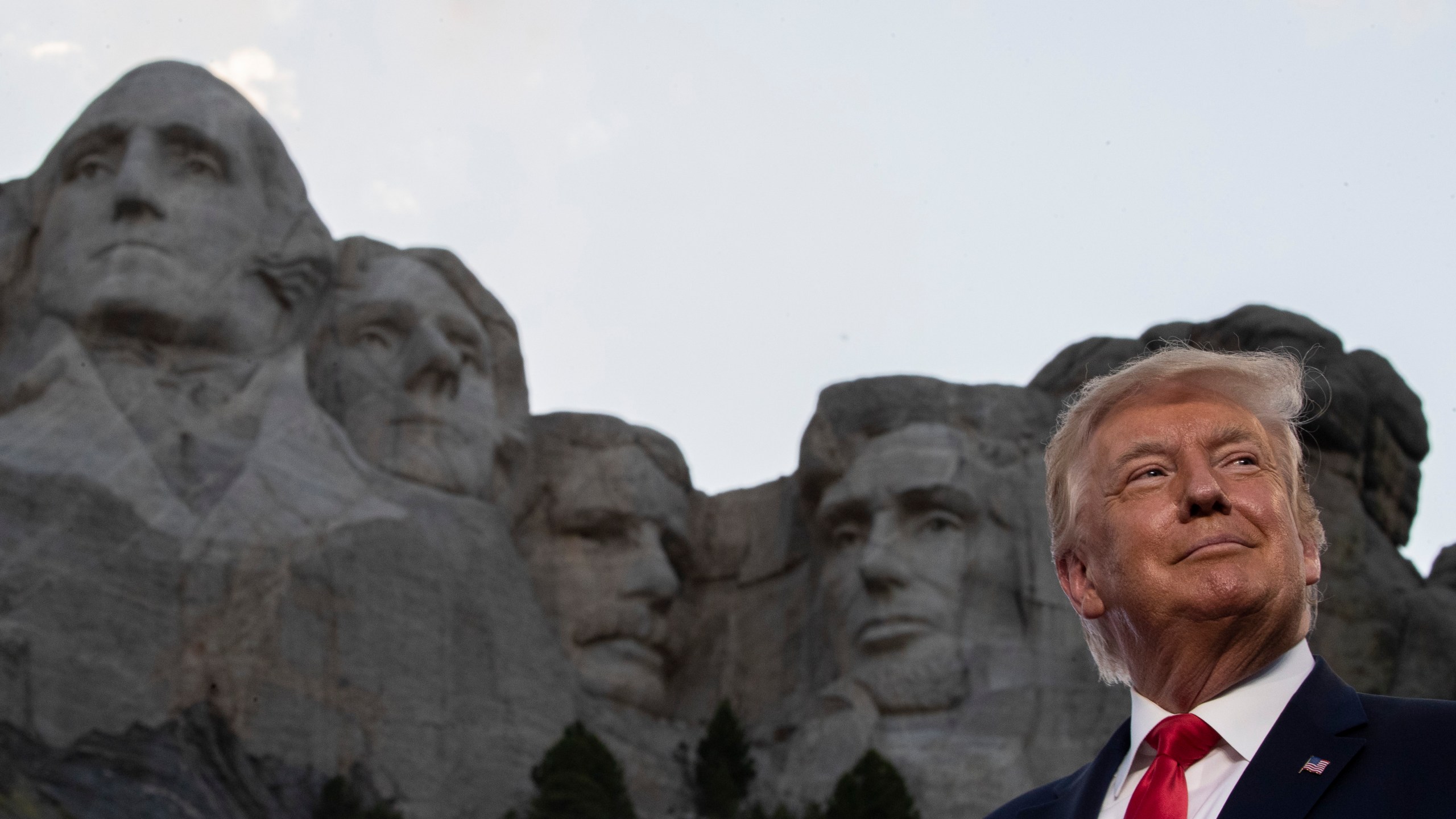 FILE - Then-President Donald Trump stands at Mount Rushmore National Memorial on July 3, 2020, near Keystone, S.D. (AP Photo/Alex Brandon, File)