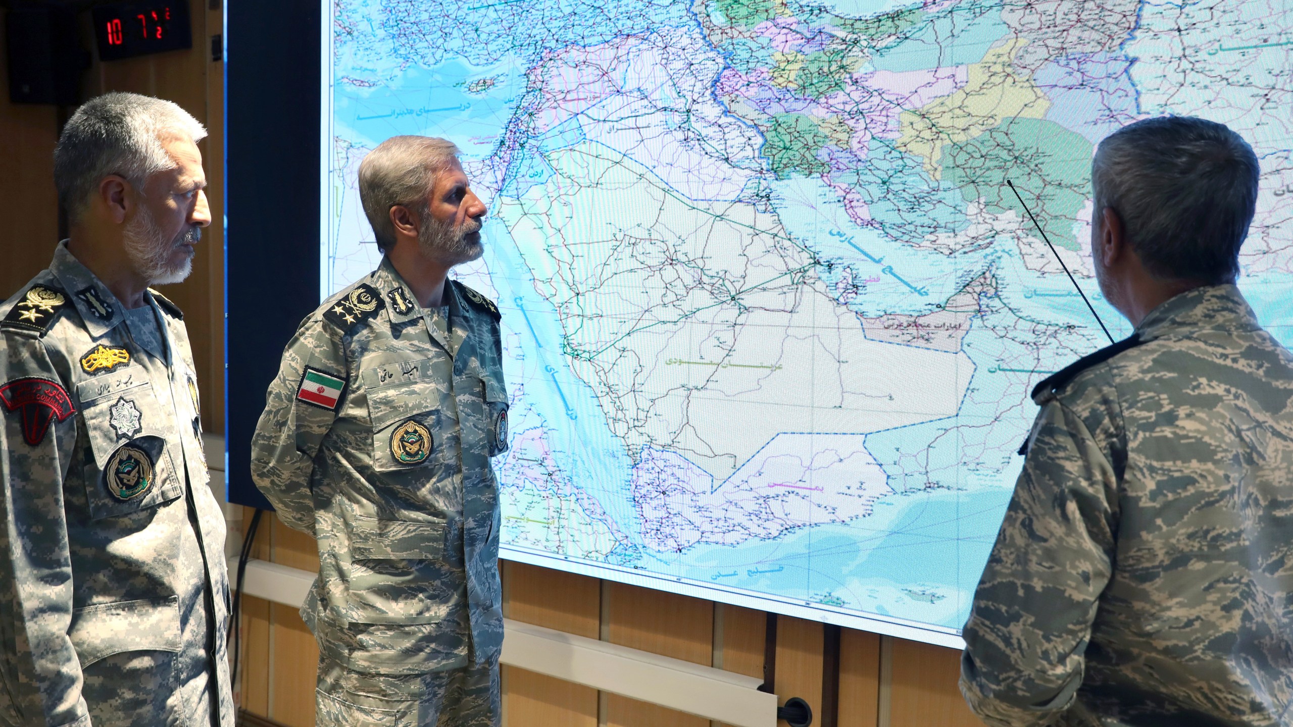 In this photo released on Monday, June 23, 2025, by Iranian army press service, Iran's army commander-in-chief Gen. Amir Hatami, center, Admiral Mahmoud Mousavi, right, and Admiral Habibollah Sayyari attend a meeting in Zolfaghar central headquarters, Iran. (Iranian Army Press Service via AP)