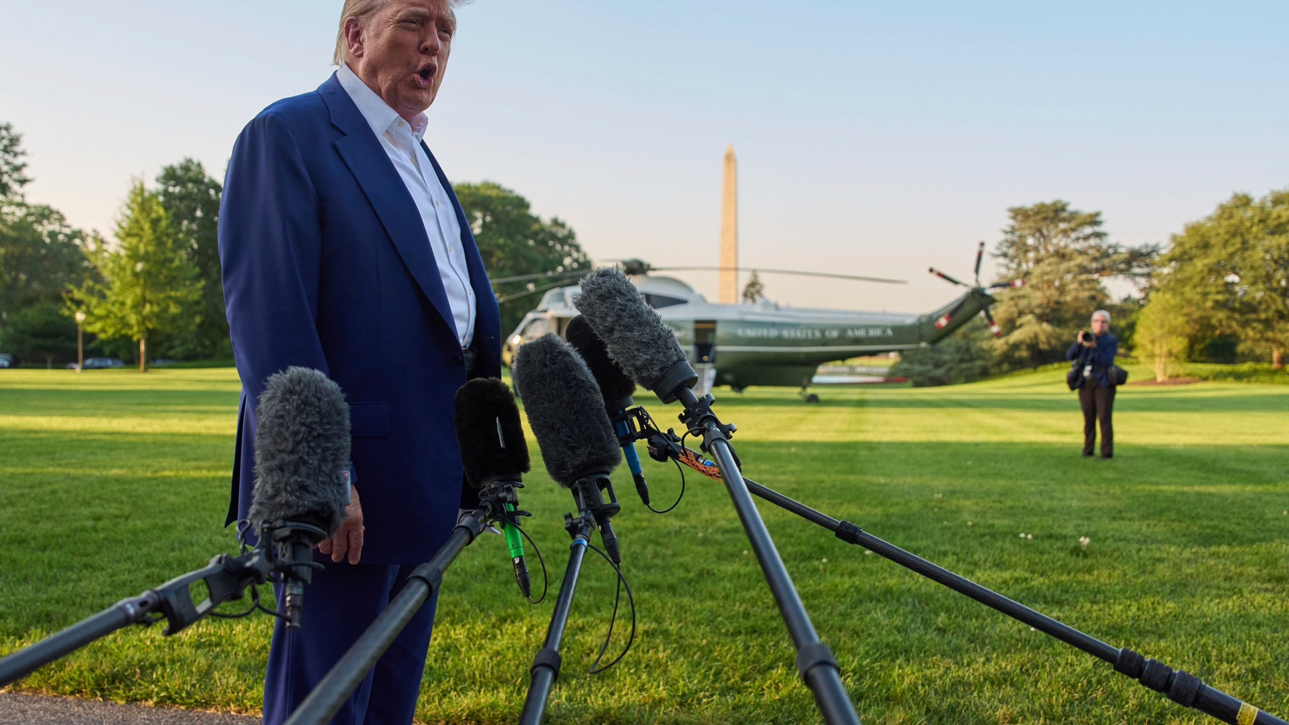President Donald Trump speaks with reporters before boarding Marine One on the South Lawn of the White House, Tuesday, June 24, 2025, in Washington. (AP Photo/Evan Vucci)