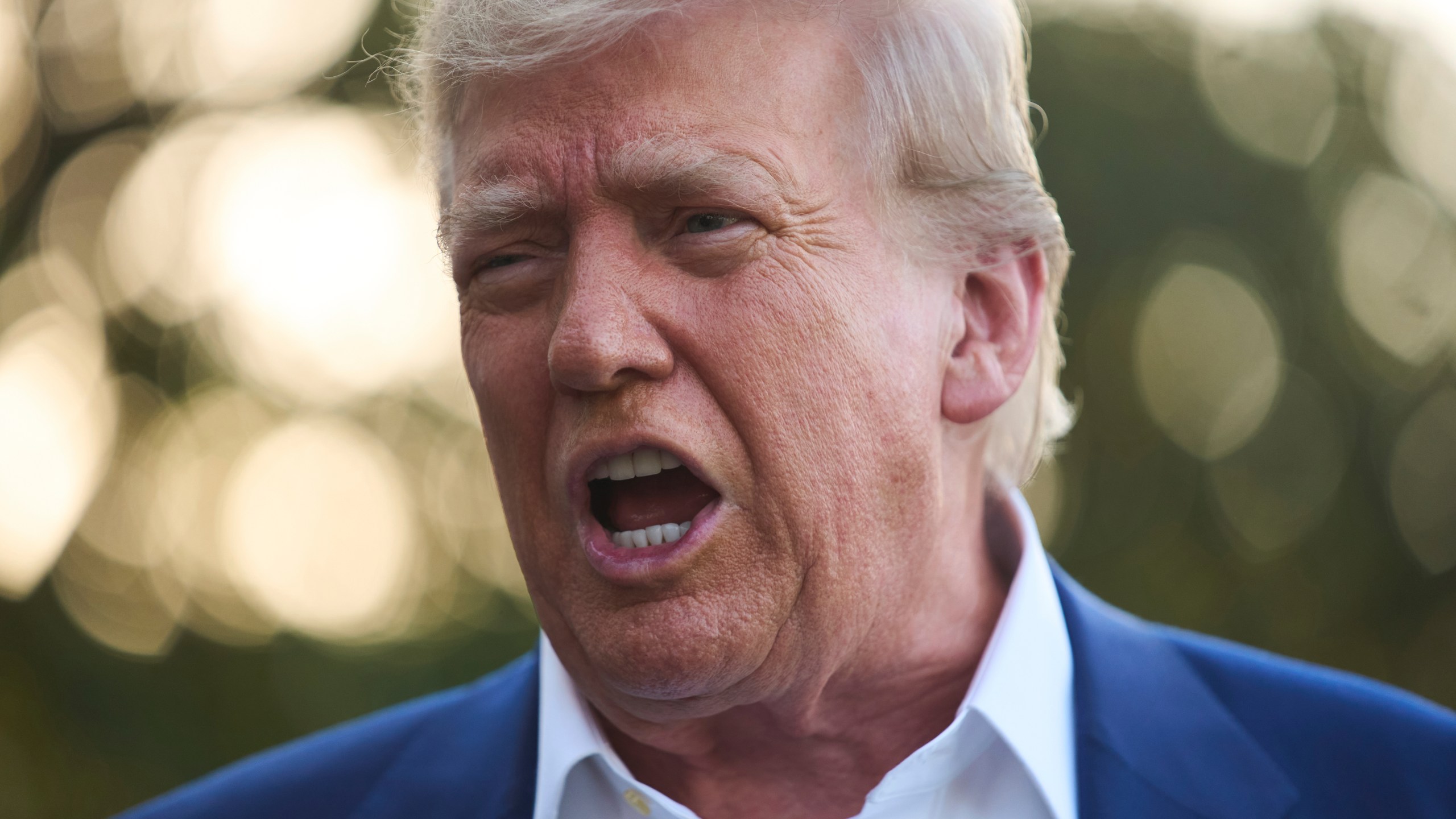 President Donald Trump speaks with reporters before boarding Marine One on the South Lawn of the White House, Tuesday, June 24, 2025, in Washington. (AP Photo/Evan Vucci)