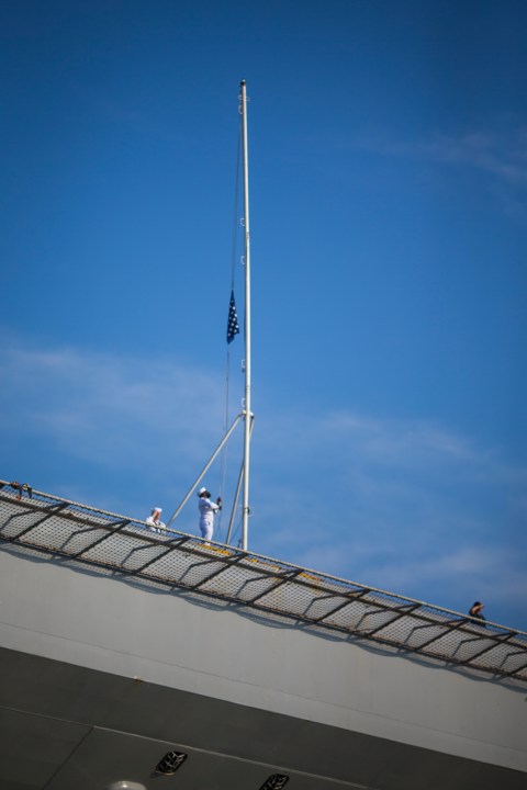 Sailors raise the Colors as the USS Gerald R. Ford aircraft carrier prepares to go underway from Naval Station Norfolk, Tuesday, June 24, 2025, in Norfolk, Va. (AP Photo/John Clark)