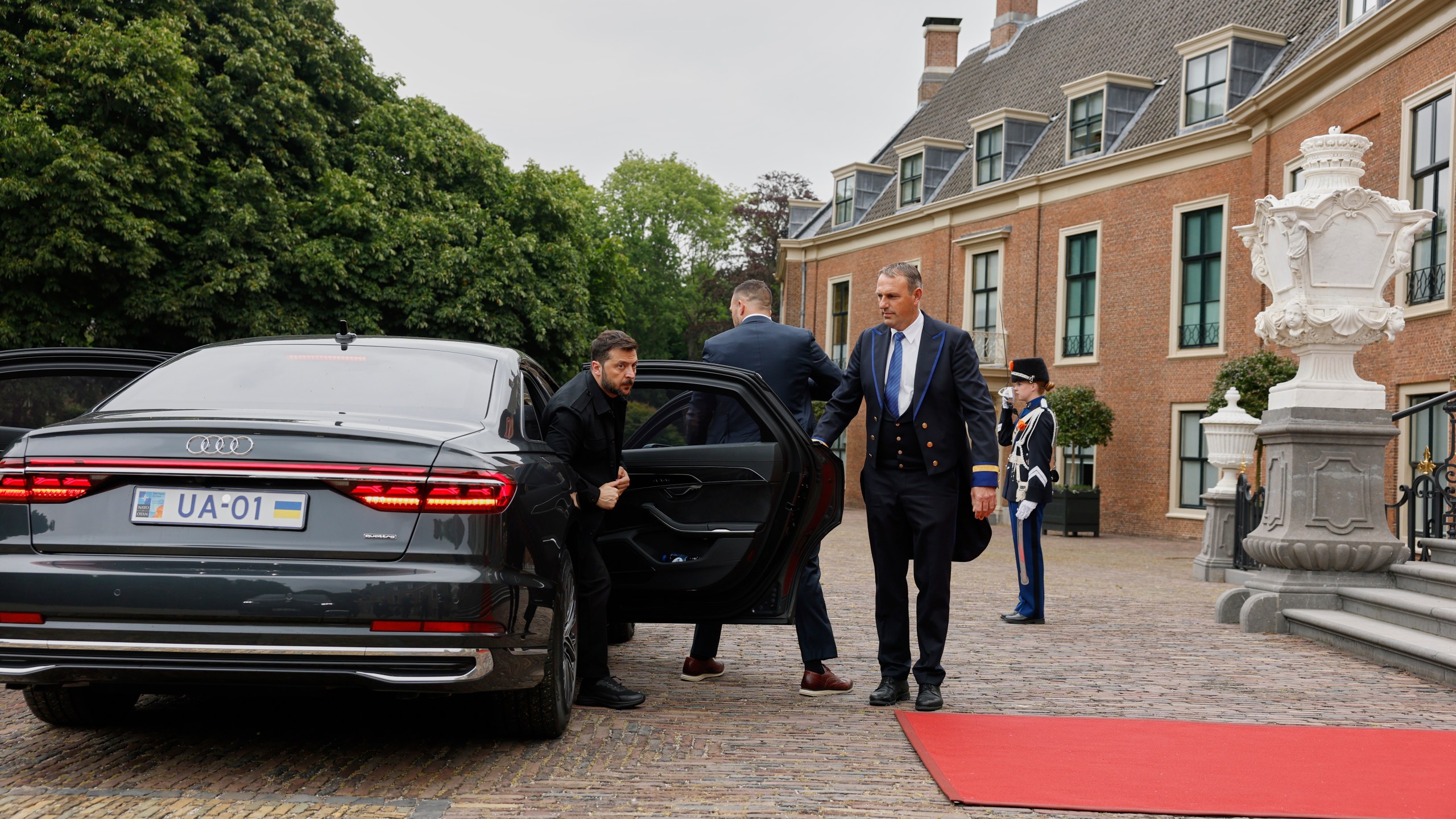 Ukraine's President Volodymyr Zelenskyy, left, arrives at the Paleis Huis ten Bosch ahead of a dinner on the sidelines of the NATO summit in The Hague, Netherlands, Tuesday, June 24, 2025. (Remko de Waal, Pool Photo via AP)