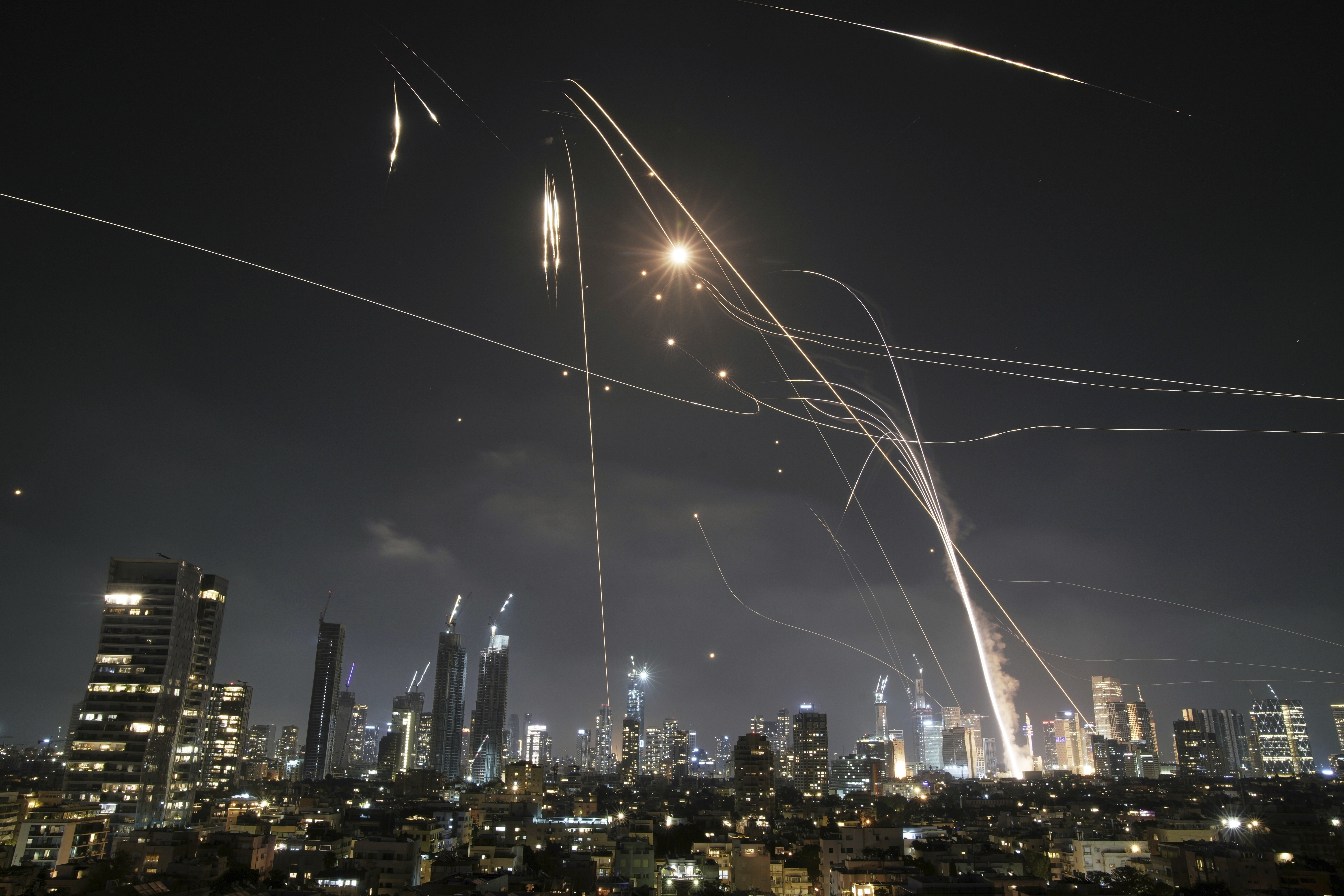 FILE - Israeli Iron Dome air defense system fires to intercept missiles over Tel Aviv, Israel, on June 13, 2025. (AP Photo/Leo Correa, File)