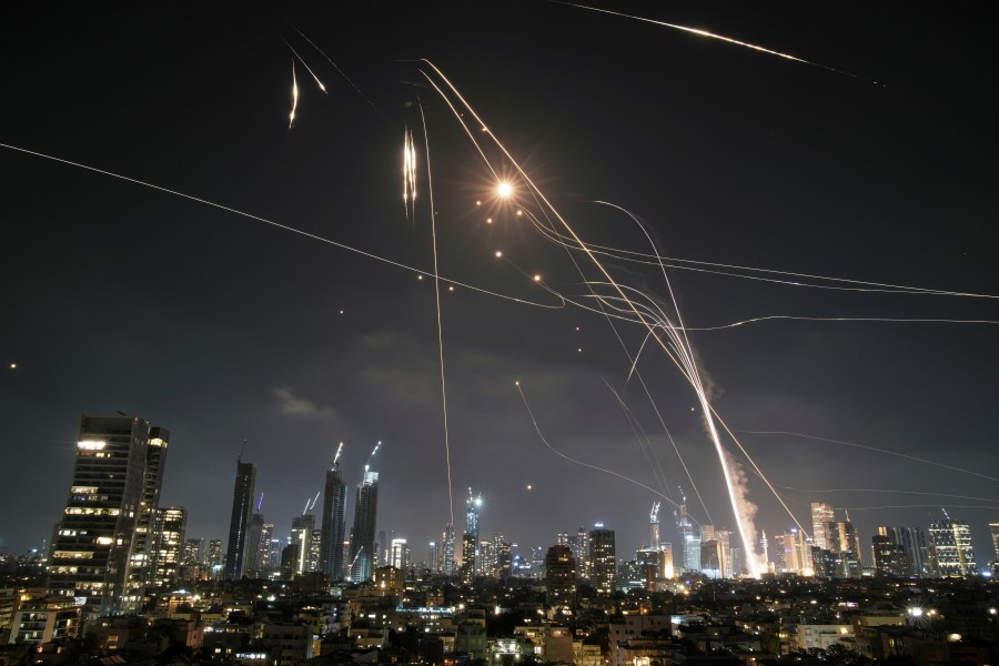 FILE - Israeli Iron Dome air defense system fires to intercept missiles over Tel Aviv, Israel, on June 13, 2025. (AP Photo/Leo Correa, File)
