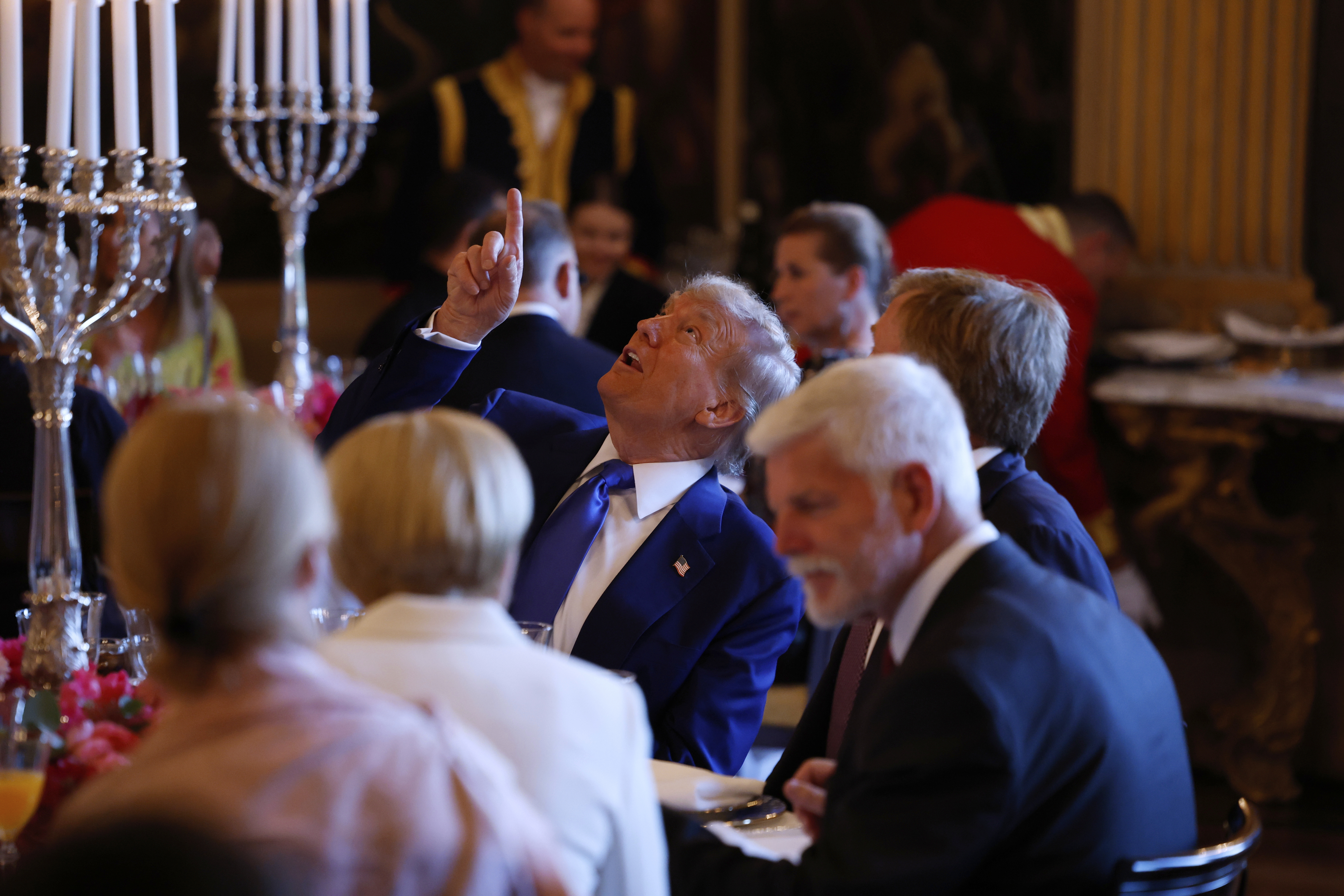 President Donald Trump, center, speaks with Netherland's King Willem Alexander during a dinner at the Paleis Huis ten Bosch ahead of the NATO summit in The Hague, Netherlands, Tuesday, June 24, 2025. (Remko de Waal, Pool Photo via AP)