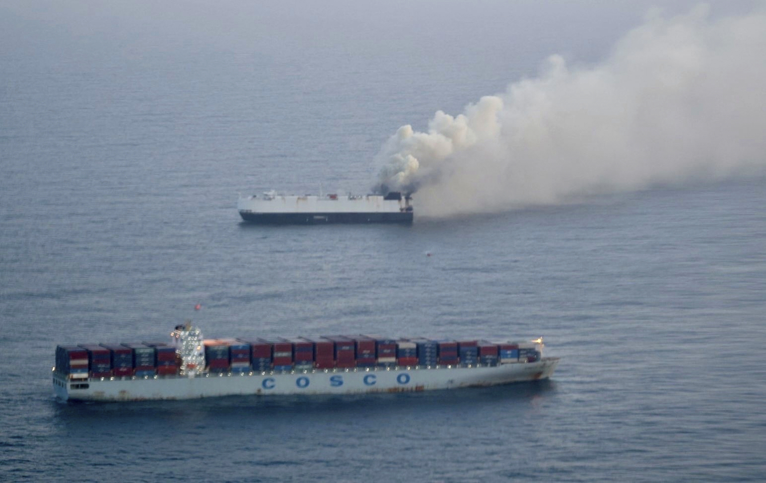 FILE - In this photo provided by the U.S. Coast Guard, smoke rises from cargo vessel Morning Midas approximately 300 miles south of Adak, Alaska, June 3, 2025. (U.S. Coast Guard/Courtesy of Air Station Kodiak via AP, File)