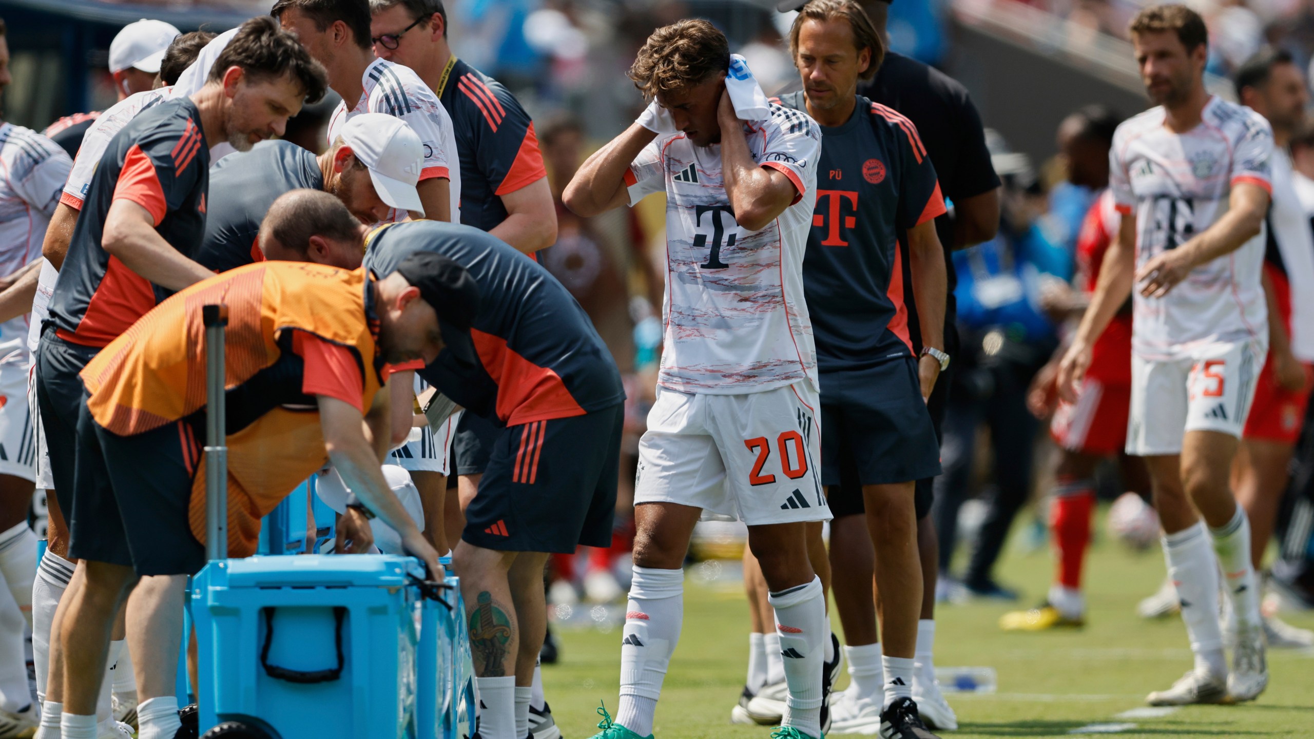 Bayern players take a cooling break during the Club World Cup Group C soccer match between Benfica and Bayern Munich in Charlotte, N.C., Tuesday, June 24, 2025. (AP Photo/Nell Redmond)