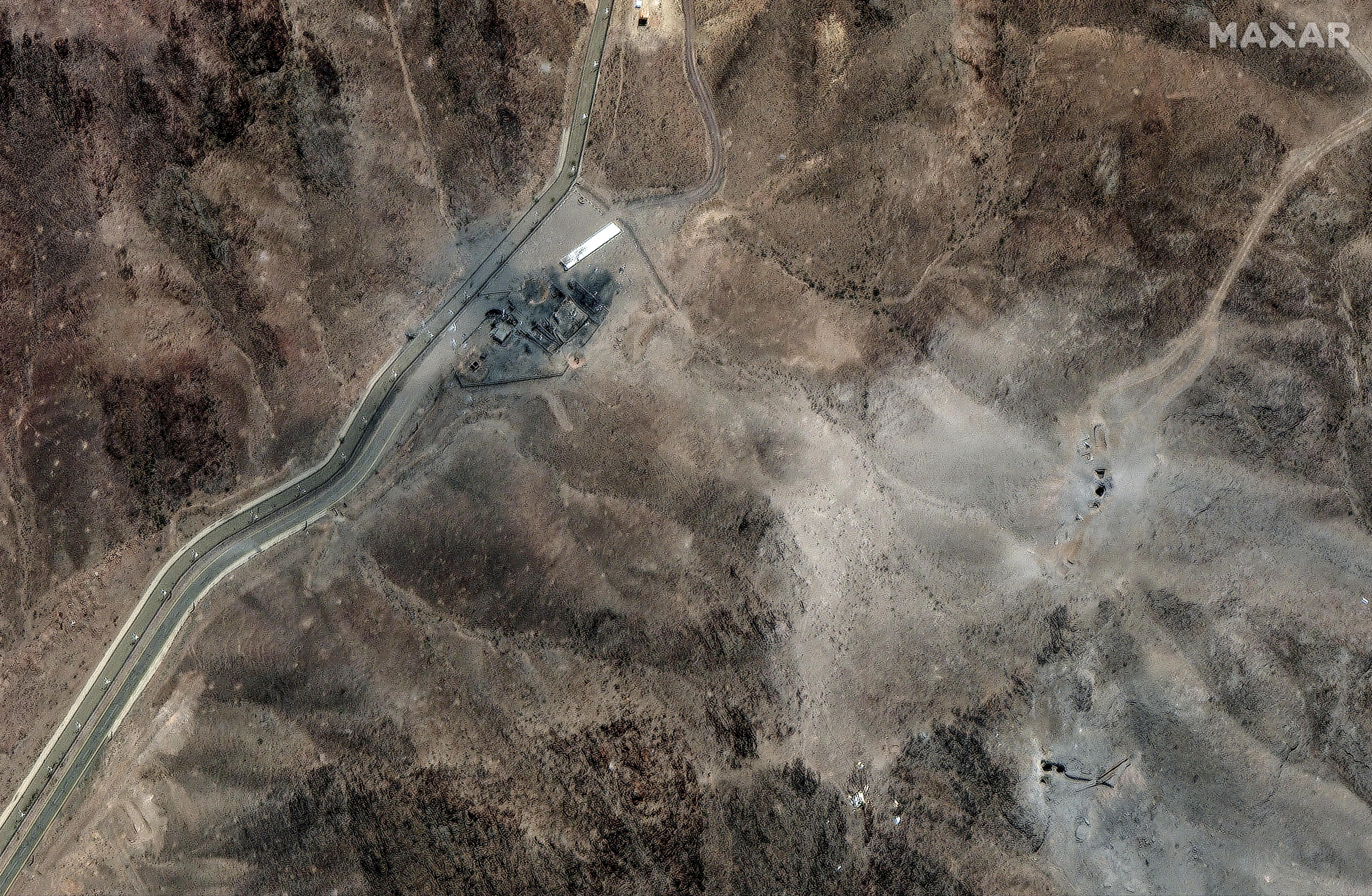 This Tuesday, June 24, 2025, satellite image provided by Maxar Technologies shows damage at Fordo enrichment facility after strikes in Iran on June 23. (Maxar Technologies via AP)