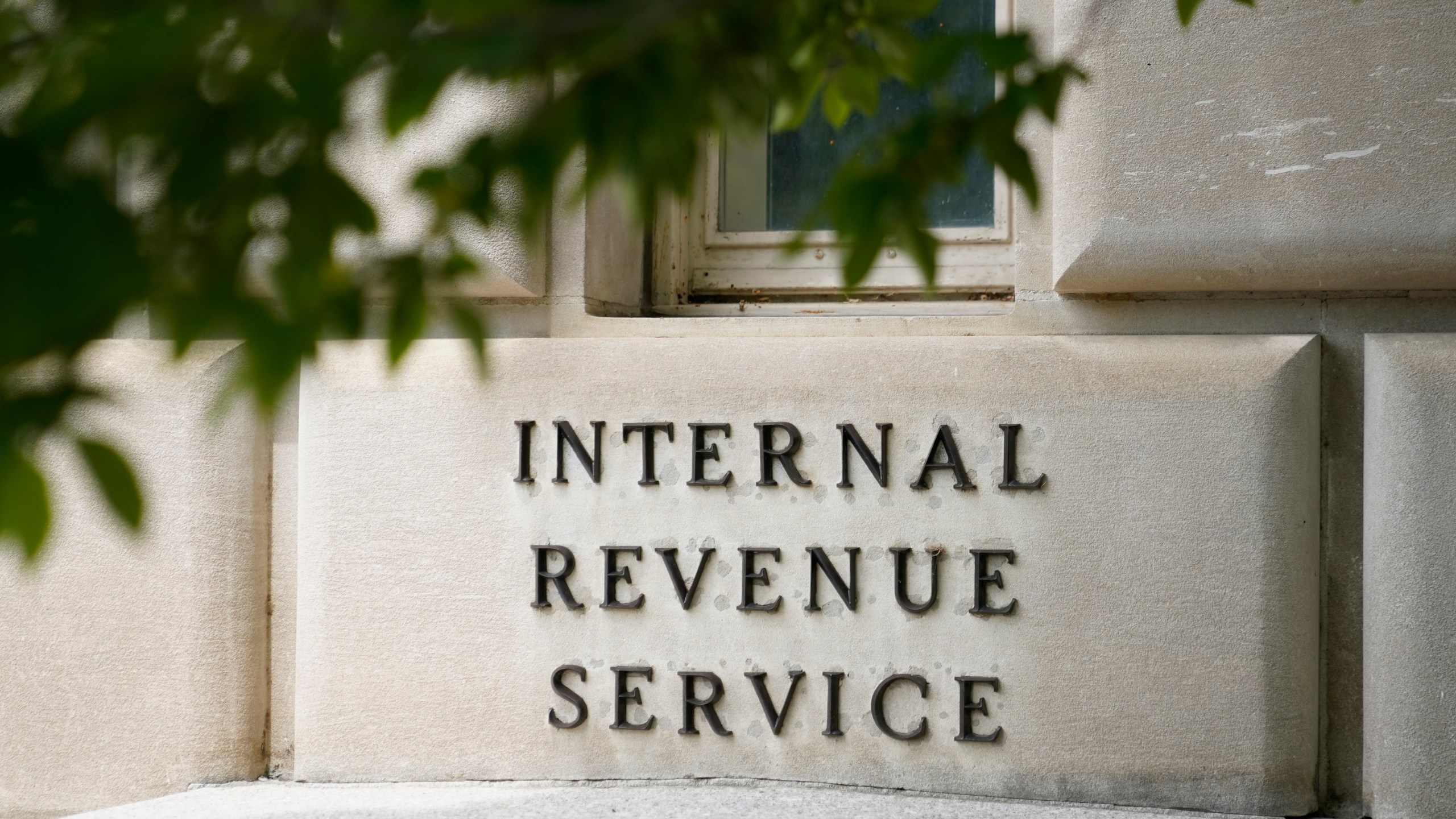 FILE - A sign outside the Internal Revenue Service building is photographed May 4, 2021, in Washington. (AP Photo/Patrick Semansky, File)