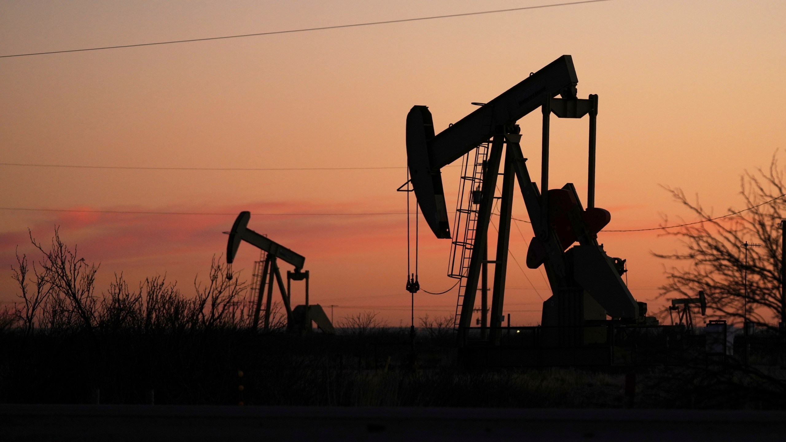 FILE - Pumpjacks are seen before sunrise in Hobbs, N.M., Feb. 24, 2025. (AP Photo/Julio Cortez, File)
