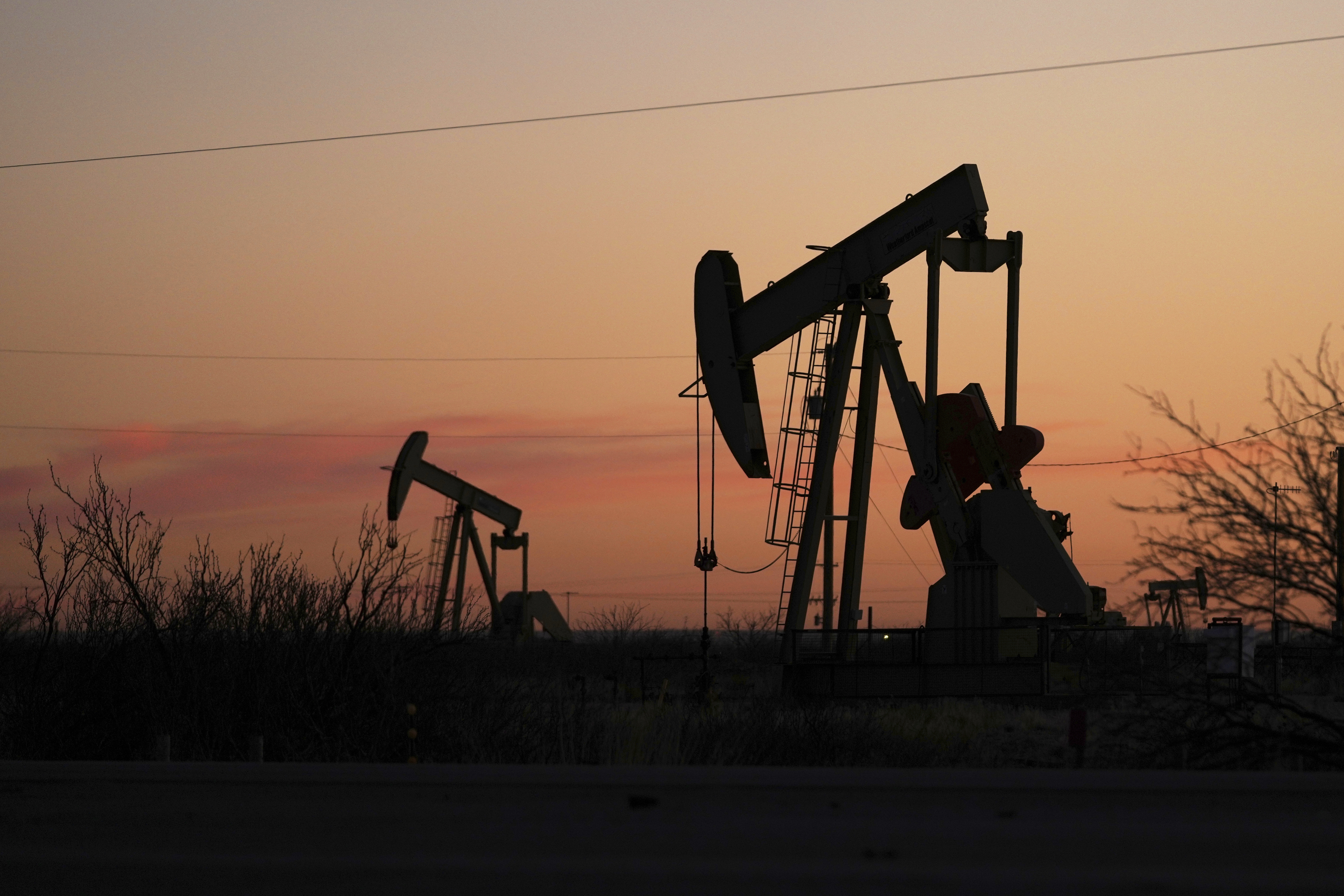 FILE - Pumpjacks are seen before sunrise in Hobbs, N.M., Feb. 24, 2025. (AP Photo/Julio Cortez, File)