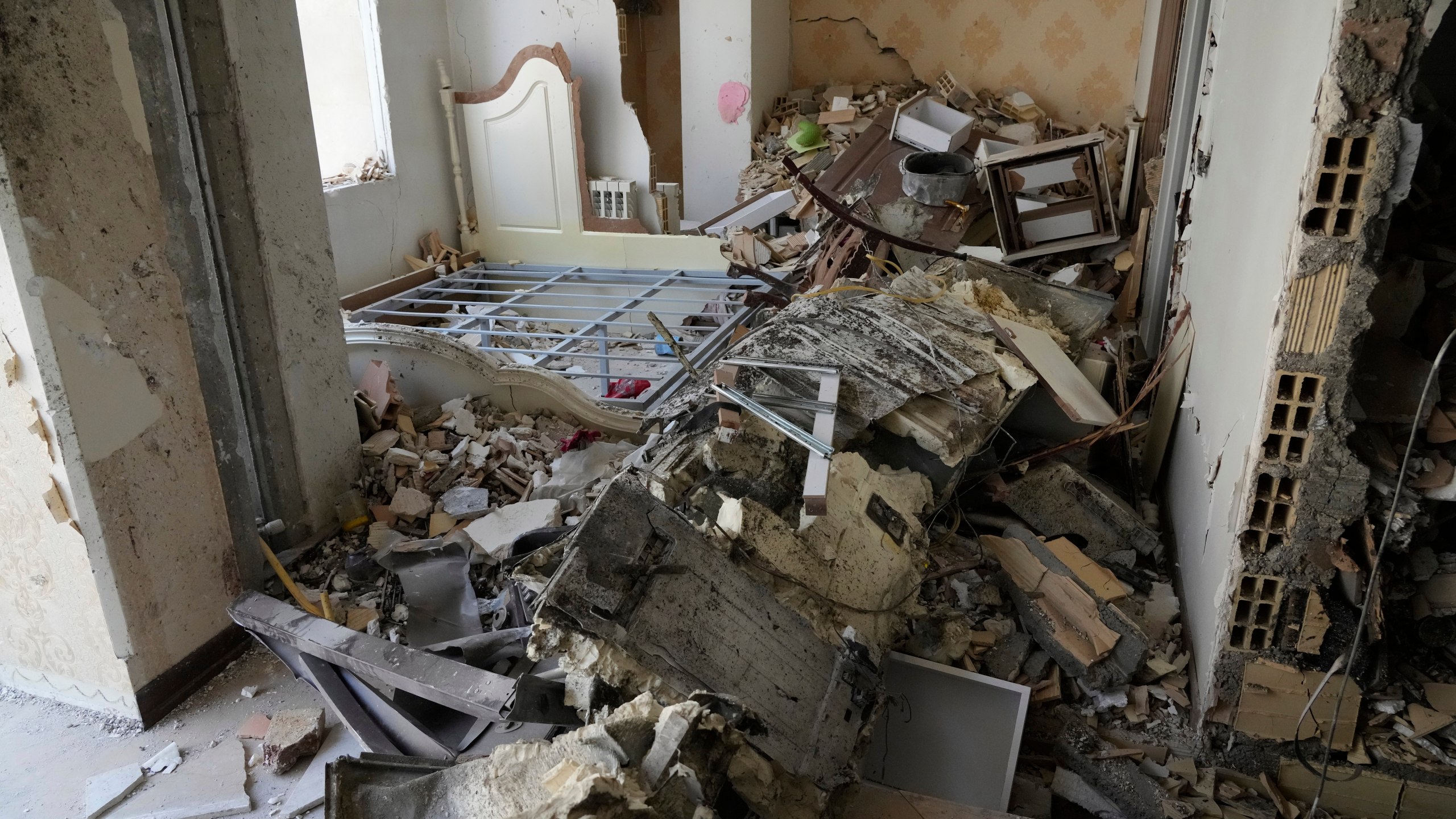 Damages of a building are seen in Tehran, Iran, Wednesday, June 25, 2025, after an Israeli strike on early Tuesday. (AP Photo/Vahid Salemi)