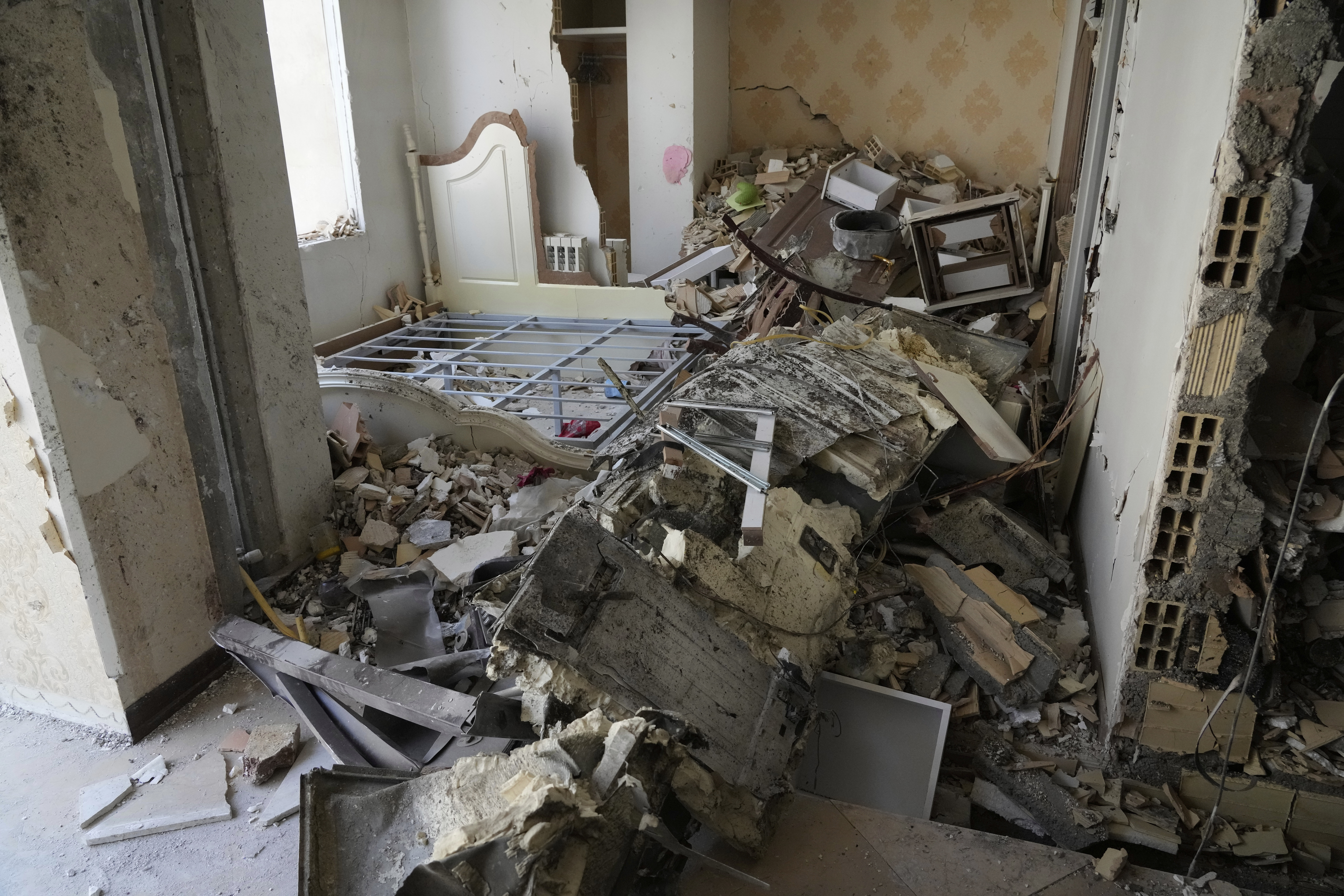 Damages of a building are seen in Tehran, Iran, Wednesday, June 25, 2025, after an Israeli strike on early Tuesday. (AP Photo/Vahid Salemi)