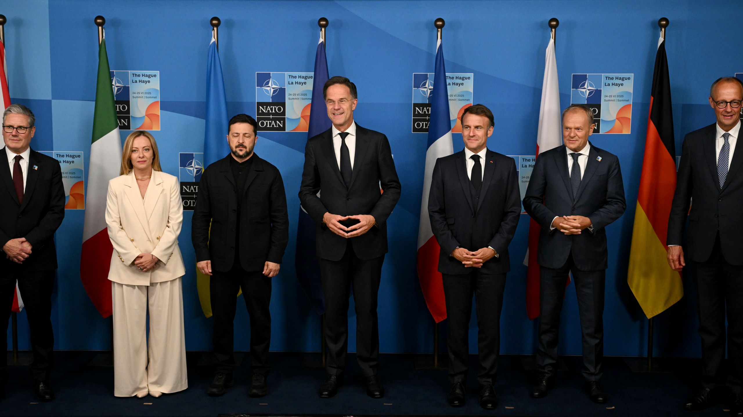 Britain's Prime Minister Keir Starmer, from left, Italy's Prime Minister Giorgia Meloni, Ukraine's President Volodymyr Zelenskyy, NATO Secretary General Mark Rutte, France's President Emmanuel Macron, Poland's Prime Minister Donald Tusk and Germany's Chancellor Friedrich Merz pose for a family picture during the meeting between the Nato secretary general and Ukrainian president with leaders of E5 Group on the sideline of the NATO summit in The Hague, Netherlands, Wednesday, June 25, 2025. (Ben Stansall/Pool Photo via AP)
