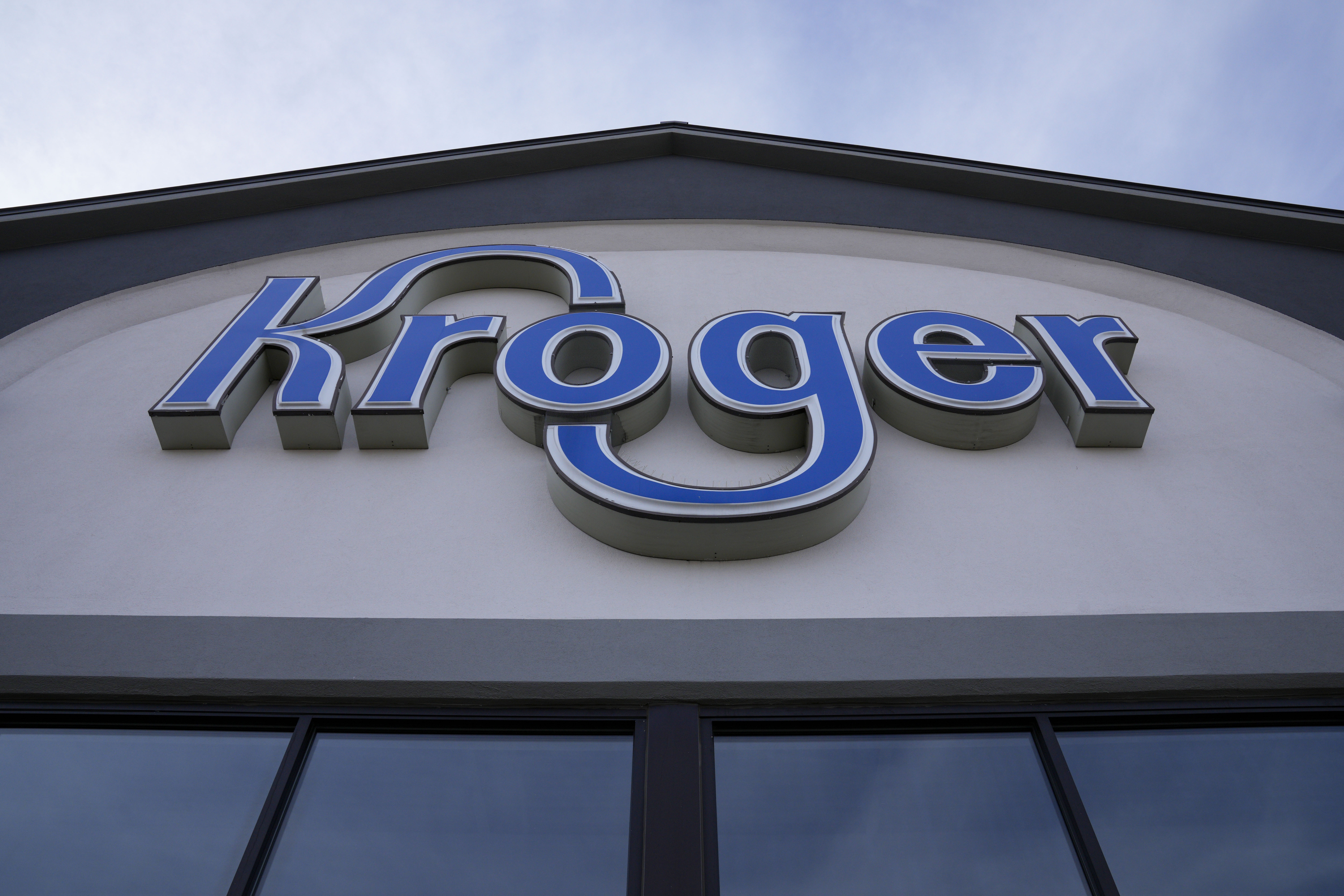 FILE - A sign is affixed to the exterior of a Kroger grocery store in Monroe, Ohio, in this undated photo. (AP Photo/Jeff Dean, File)