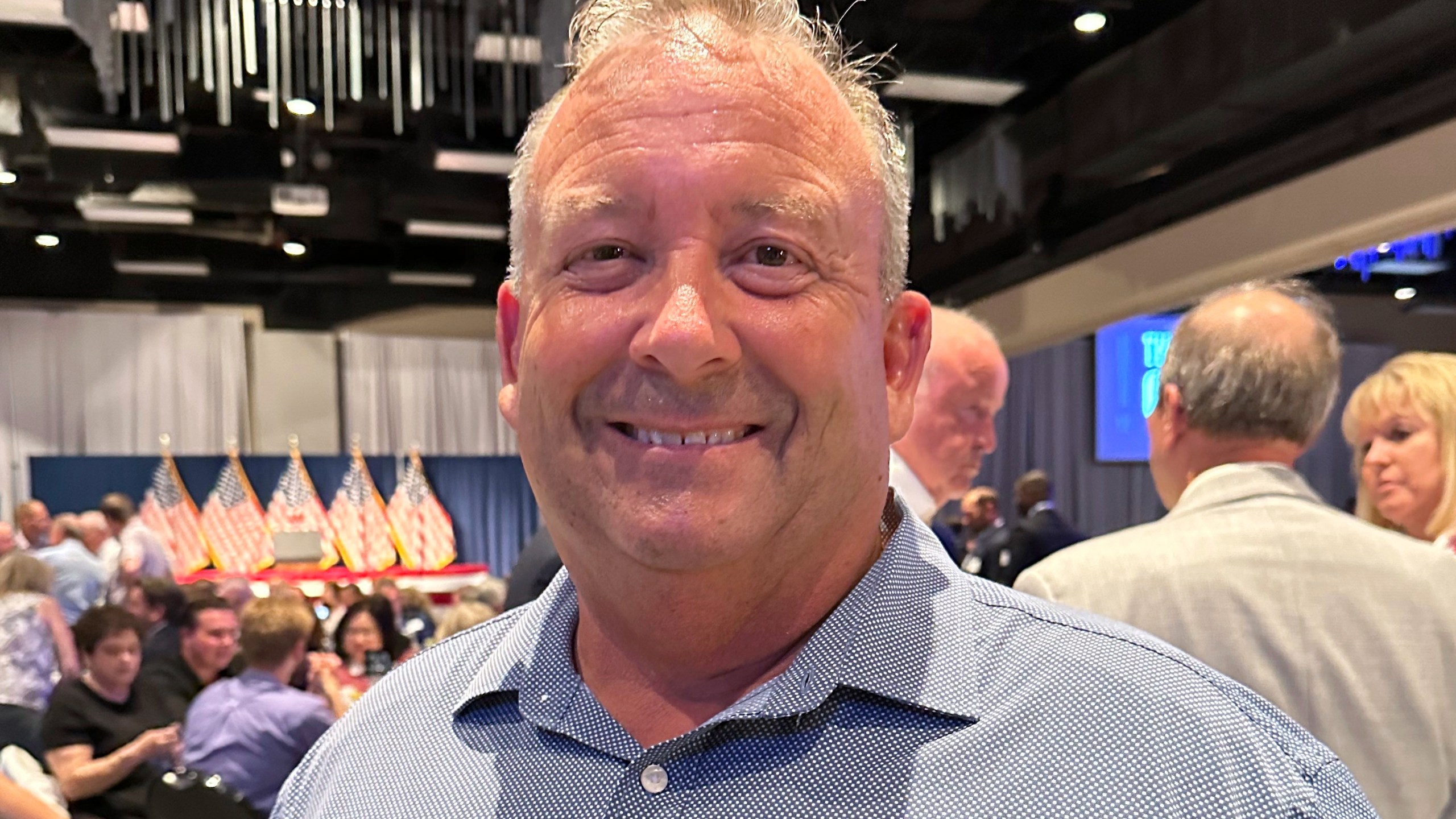 Clark Spieles, a trustee in Shawnee Township, Ohio, poses for a photo during a Republican fundraiser on Tuesday, June 24, 2025, in Lima, Ohio, featuring Vice President JD Vance. (AP Photo/Julie Carr Smyth)