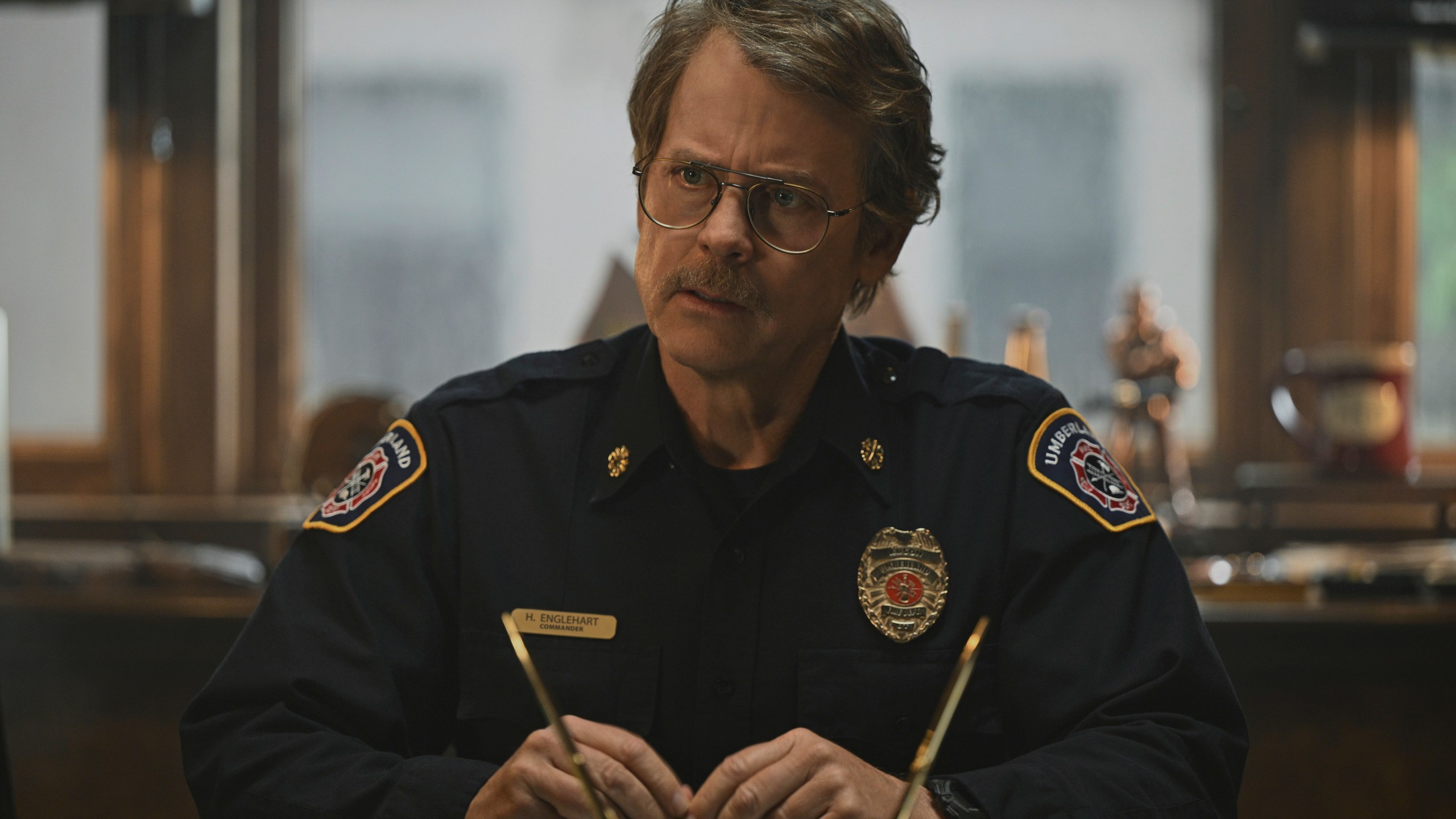 This image released by Apple TV+ shows Greg Kinnear in a scene from "Smoke." (Apple TV+ via AP)