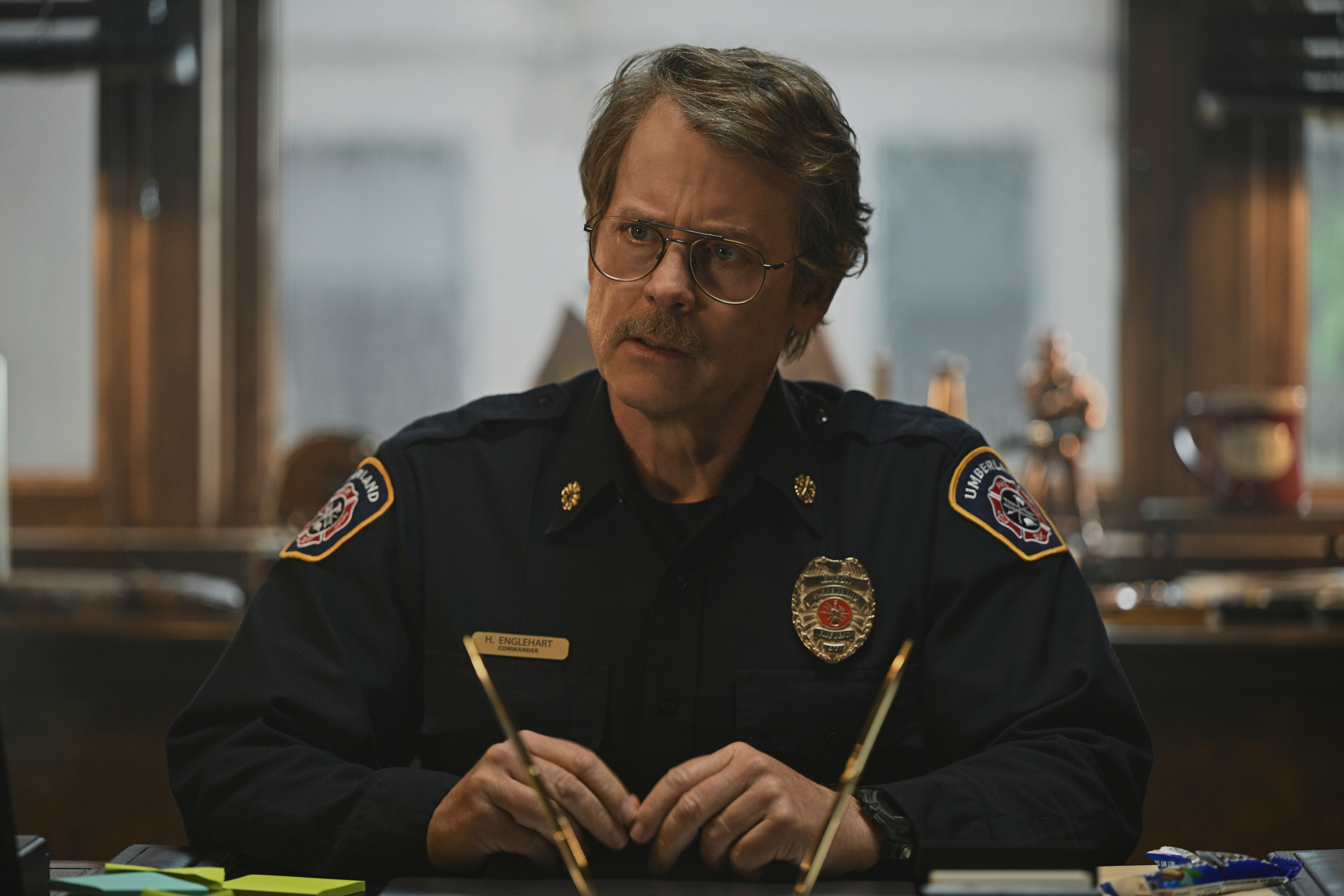 This image released by Apple TV+ shows Greg Kinnear in a scene from "Smoke." (Apple TV+ via AP)