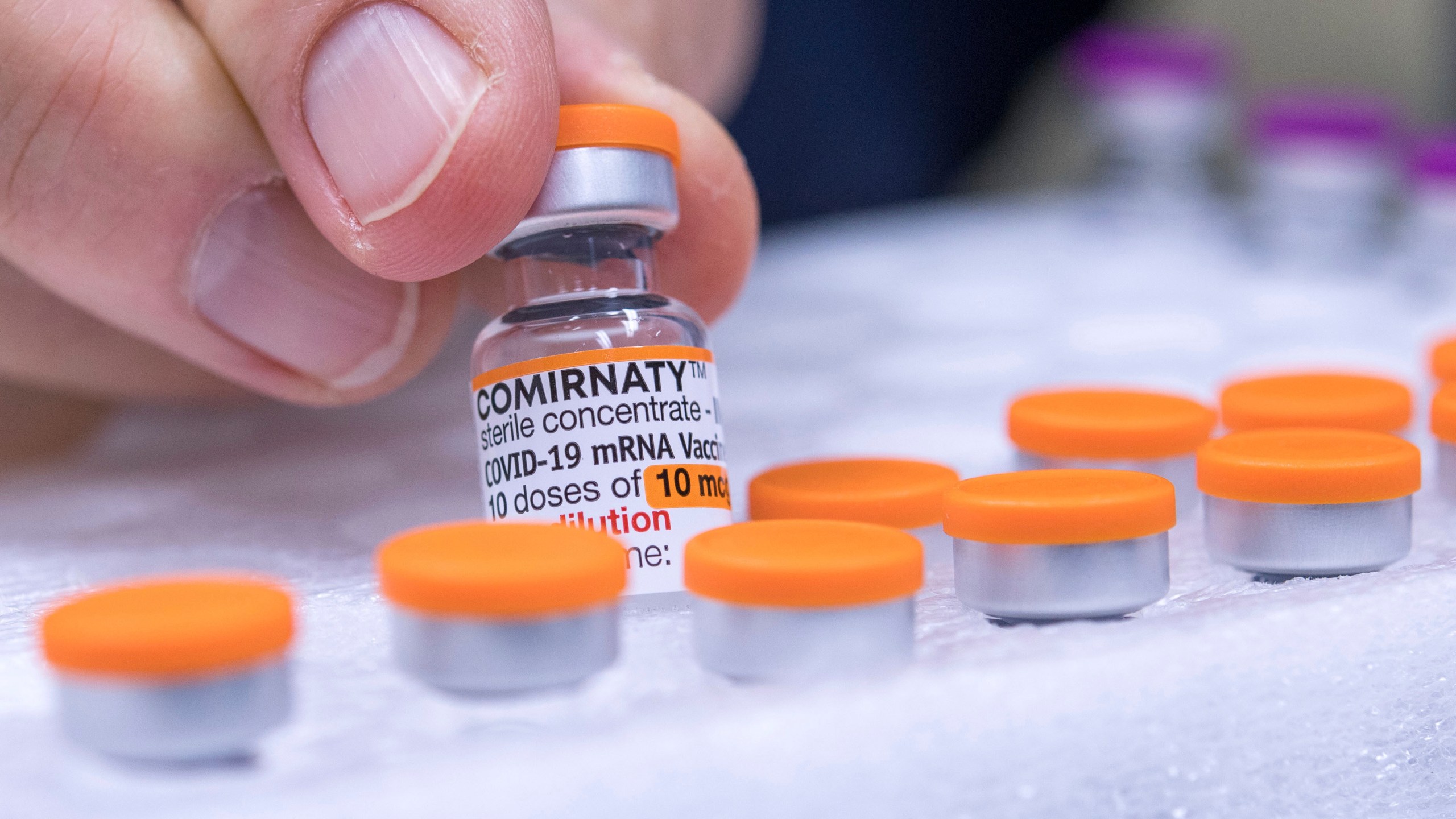 FILE - An ampoule of the vaccine "Comirnaty" for children from the manufacturer Biontech/Pfizer is pictured in a pharmacy in Duesseldorf, Germany, Dec. 13, 2021. (Marius Becker/dpa via AP, File)