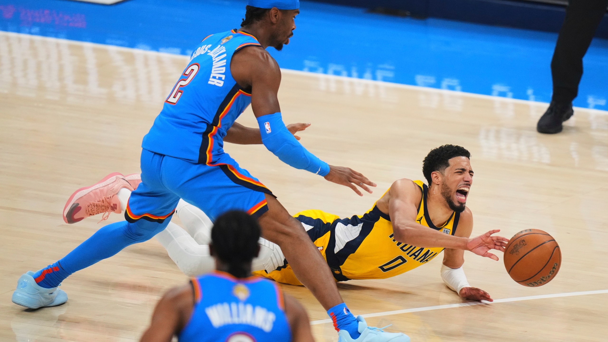 Indiana Pacers guard Tyrese Haliburton (0) falls to the court with an injury during the first half of Game 7 of the NBA Finals basketball series against the Oklahoma City Thunder Sunday, June 22, 2025, in Oklahoma City. (AP Photo/Nate Billings)