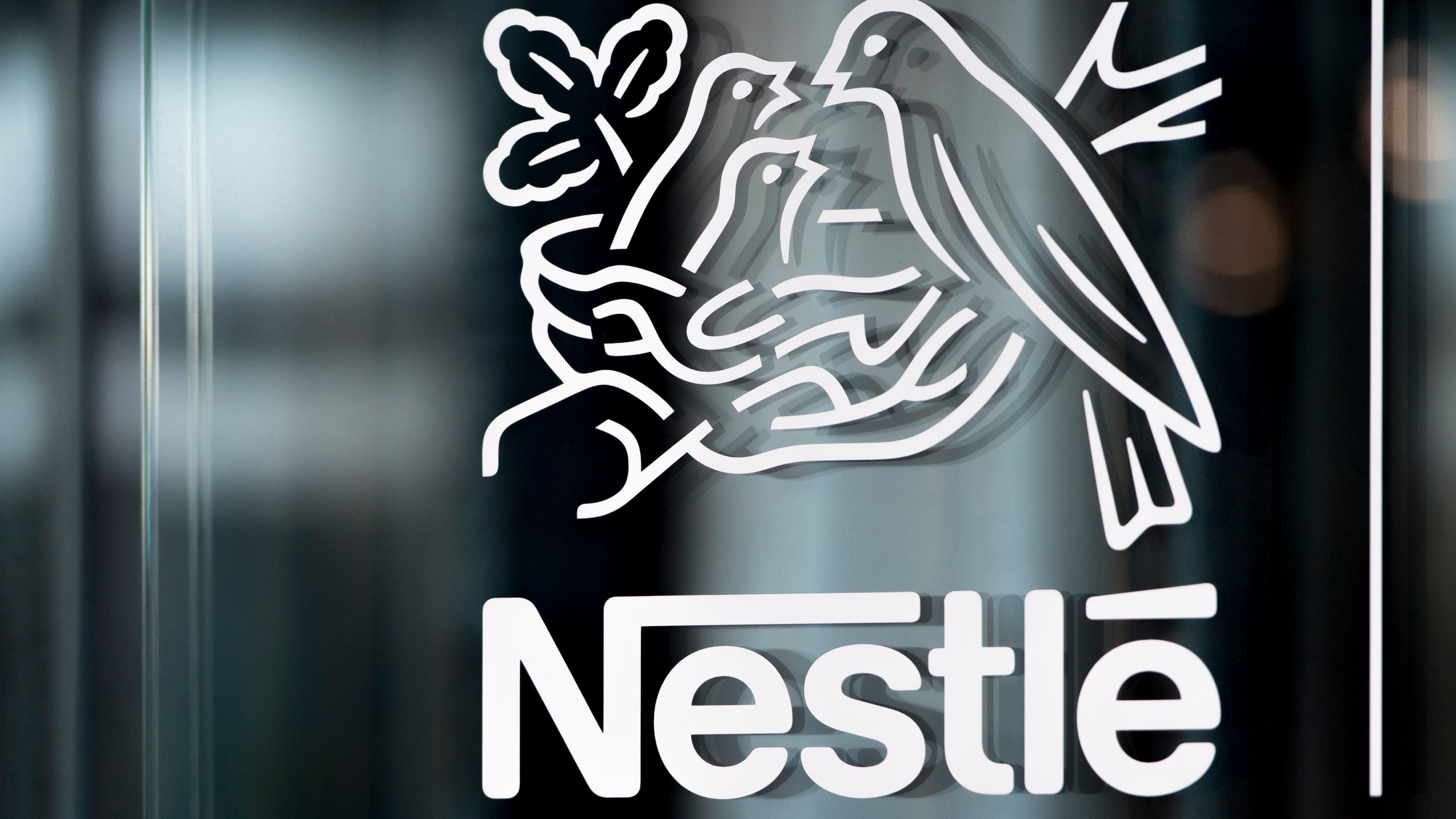 FILE - Nestle's logo is displayed on a window in Vevey, Switzerland, Feb. 14, 2019. (Laurent Gillieron/Keystone via AP, File)