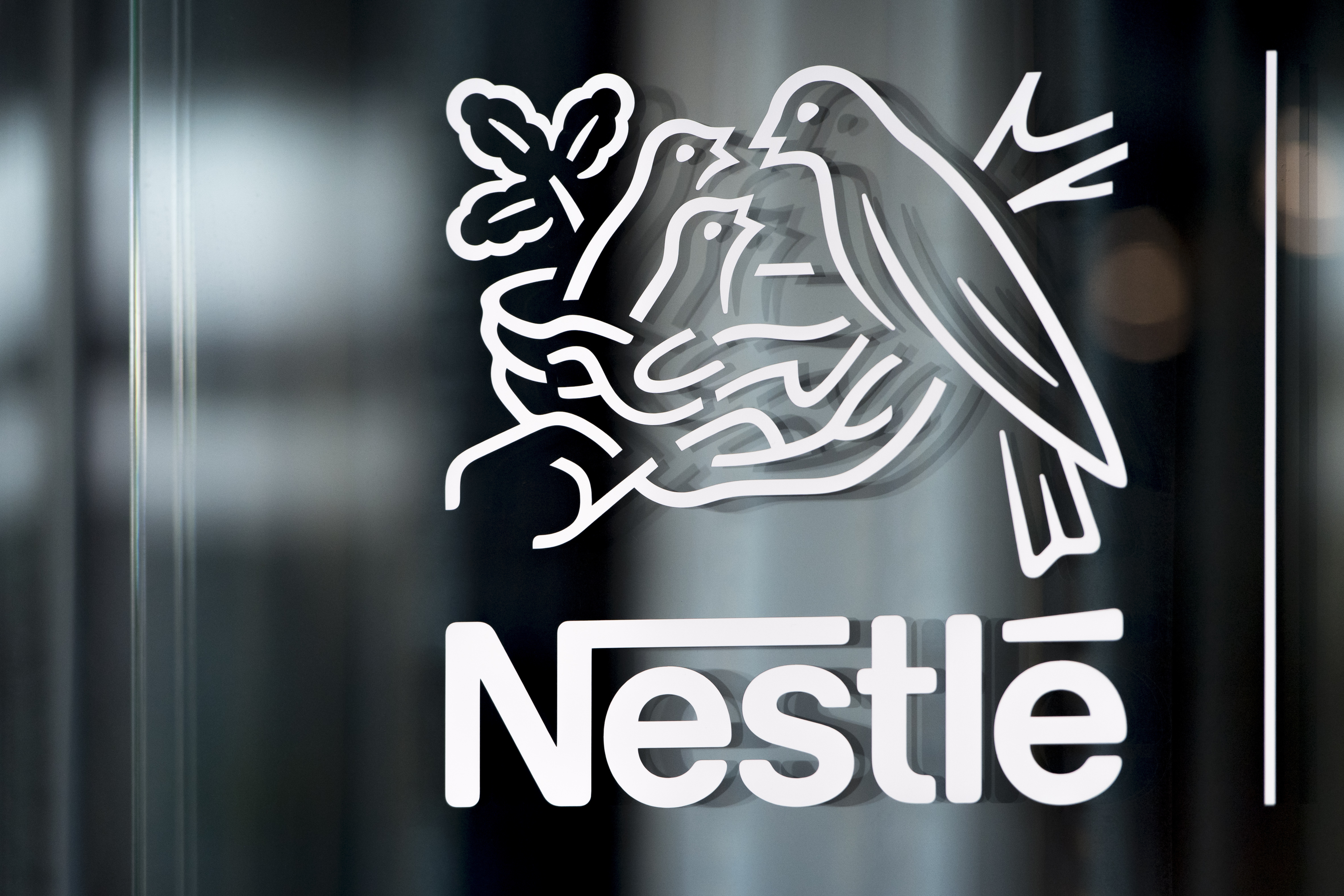 FILE - Nestle's logo is displayed on a window in Vevey, Switzerland, Feb. 14, 2019. (Laurent Gillieron/Keystone via AP, File)