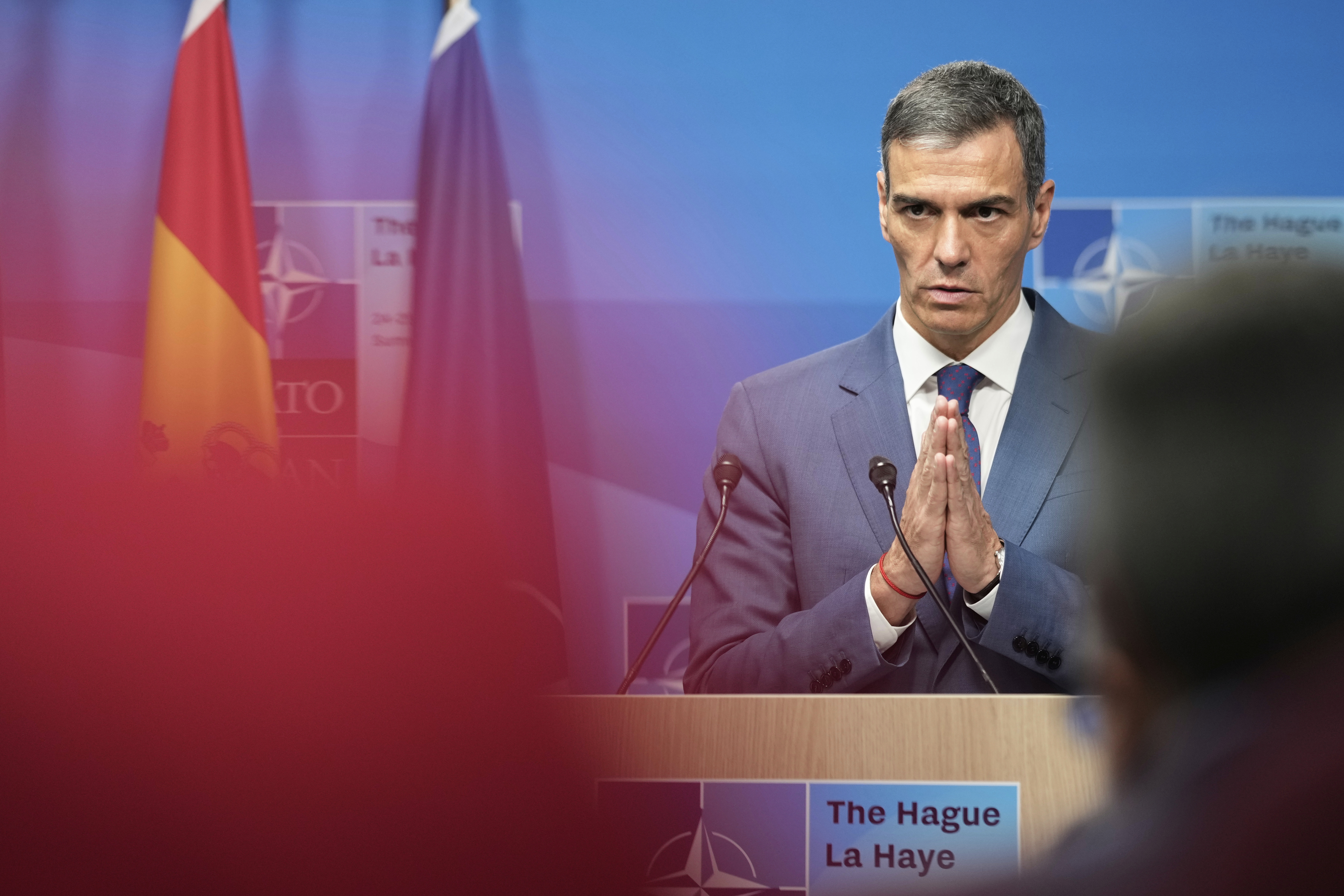 Spain's Prime Minister Pedro Sanchez gestures during a press conference after the plenary session at the NATO summit in The Hague, Netherlands, Wednesday, June 25, 2025. (AP Photo/Markus Schreiber)