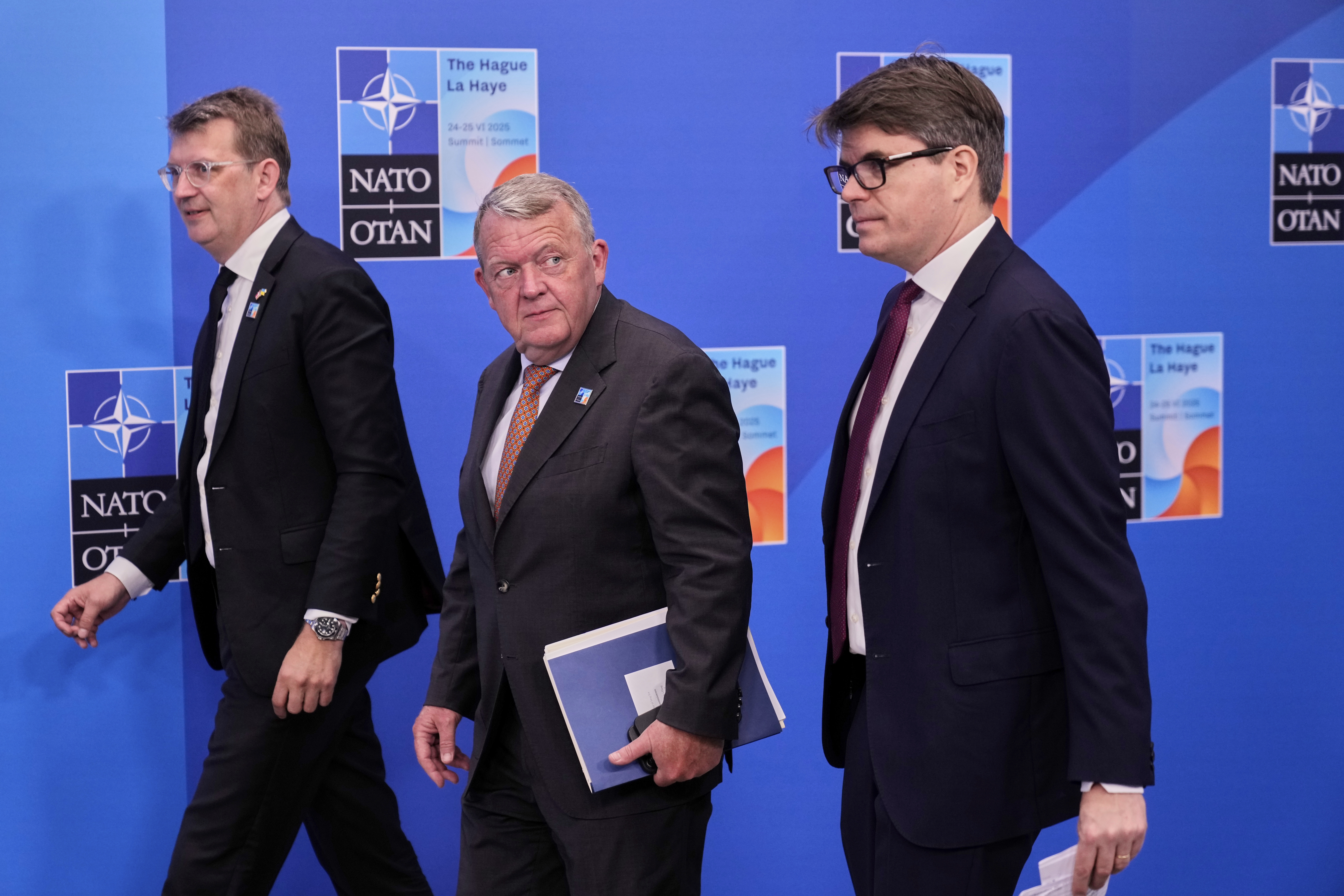 Denmark's Foreign Minister Lars Lokke Rasmussen, center, arrives for the NATO summit in The Hague, Netherlands, Wednesday, June 25, 2025. (AP Photo/Matthias Schrader)