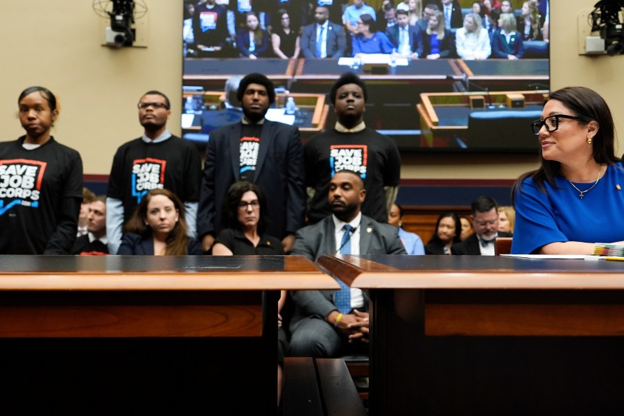 Secretary of Labor Lori Chavez-DeRemer looks as Job Corps members stand behind her during a House Education and Workforce hearing, Thursday, June 5, 2025, on Capitol Hill in Washington. (AP Photo/Julia Demaree Nikhinson)