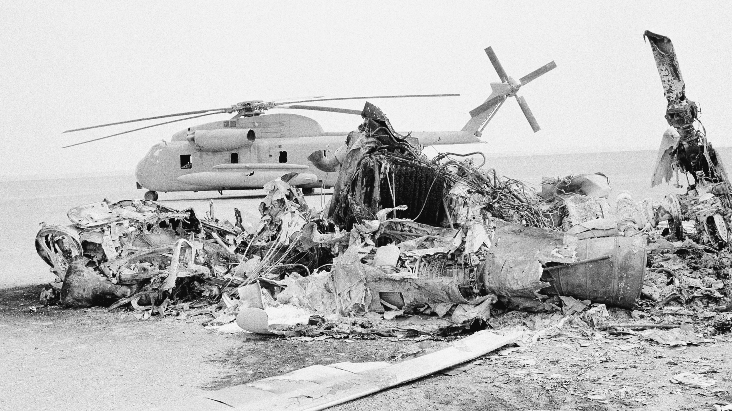 FILE - Remains of a burned-out U.S. helicopter lis photographed in the eastern desert region of Iran, April 27,1980, one day after an abortive American commando raid to free the U.S. Embassy hostages. (AP Photo, File)