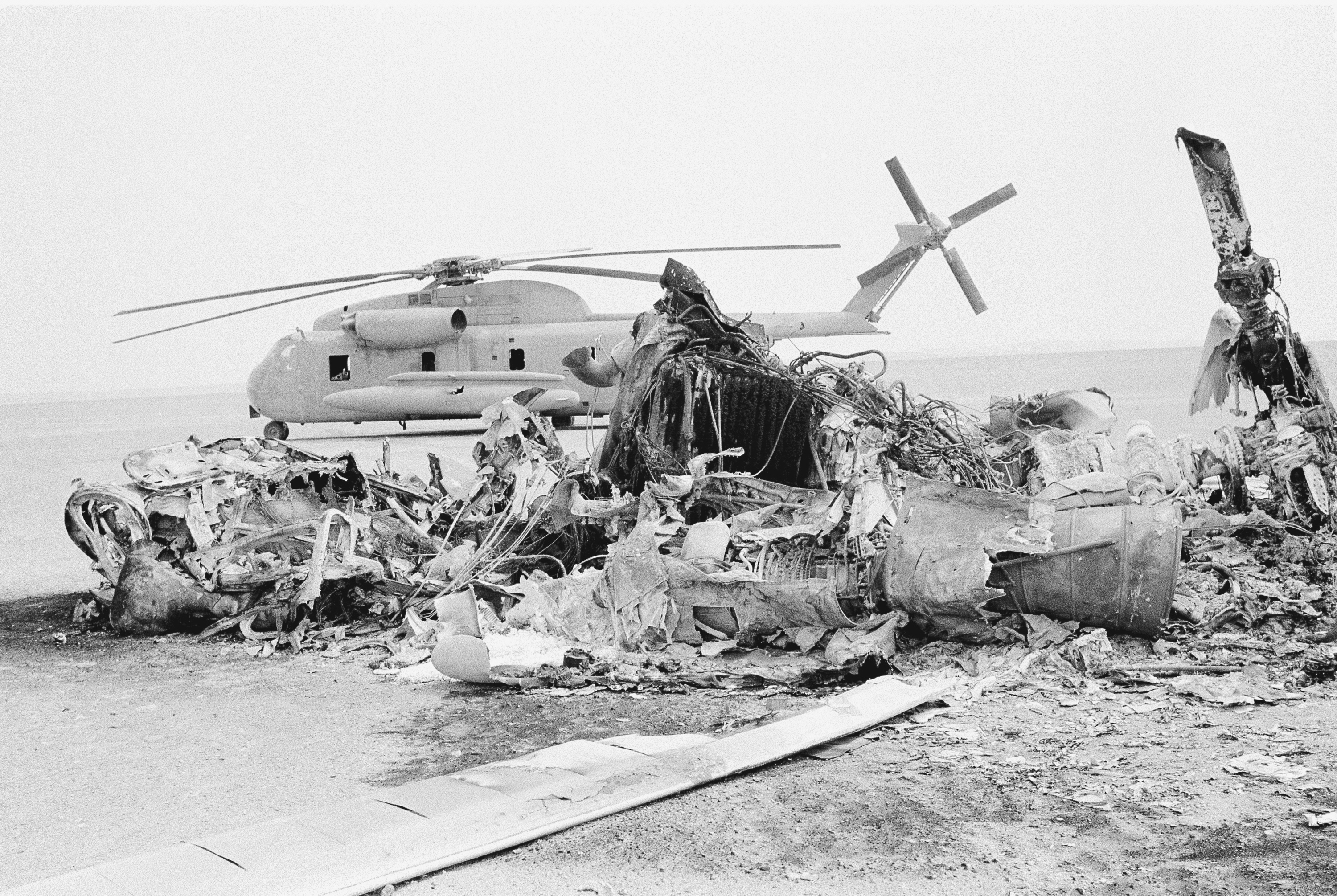 FILE - Remains of a burned-out U.S. helicopter lis photographed in the eastern desert region of Iran, April 27,1980, one day after an abortive American commando raid to free the U.S. Embassy hostages. (AP Photo, File)