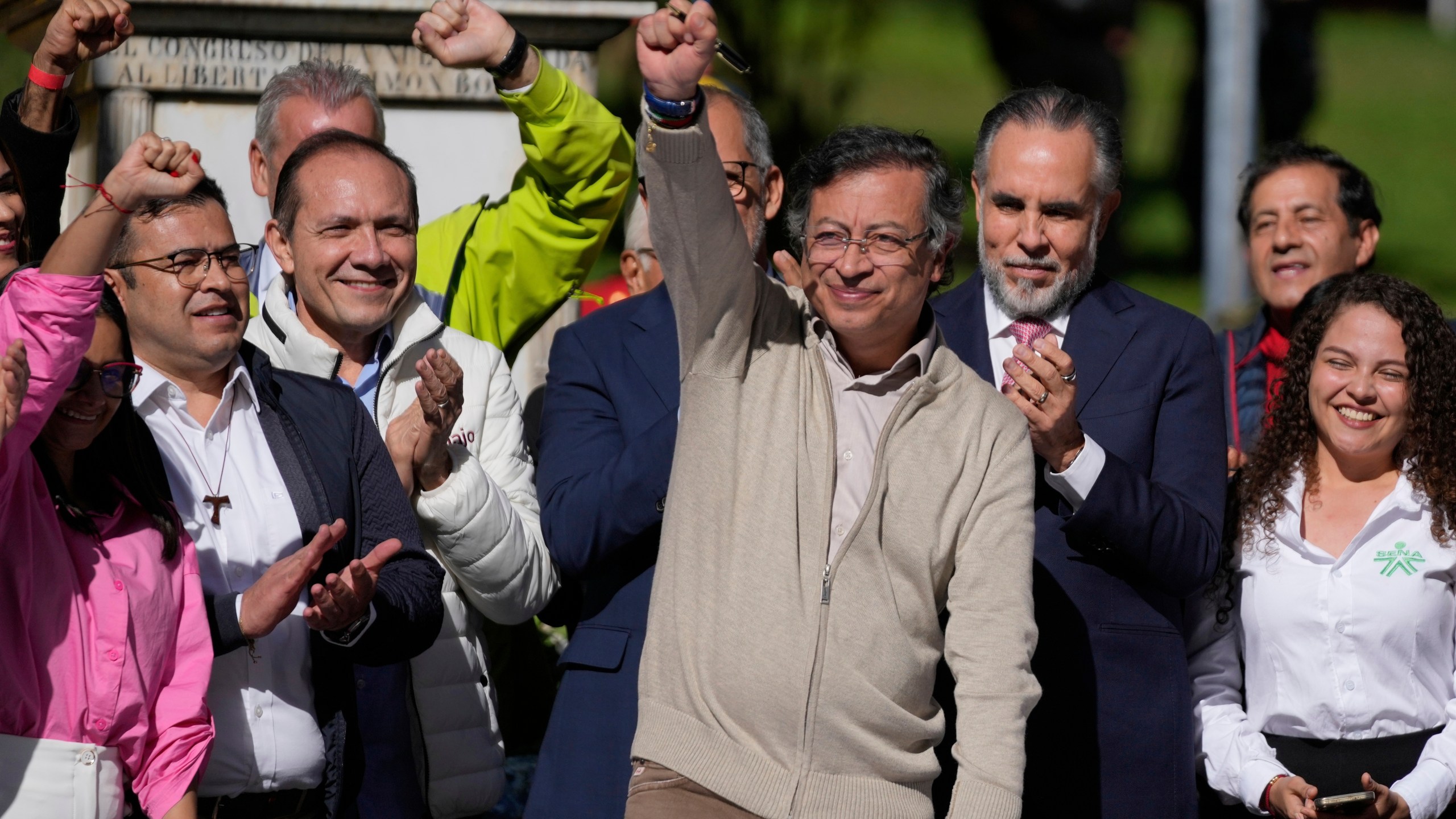 Colombia's President Gustavo Petro raises a fist before signing a labor reform bill into law in Bogota, Colombia, Wednesday, June 25, 2025. (AP Photo/Fernando Vergara)