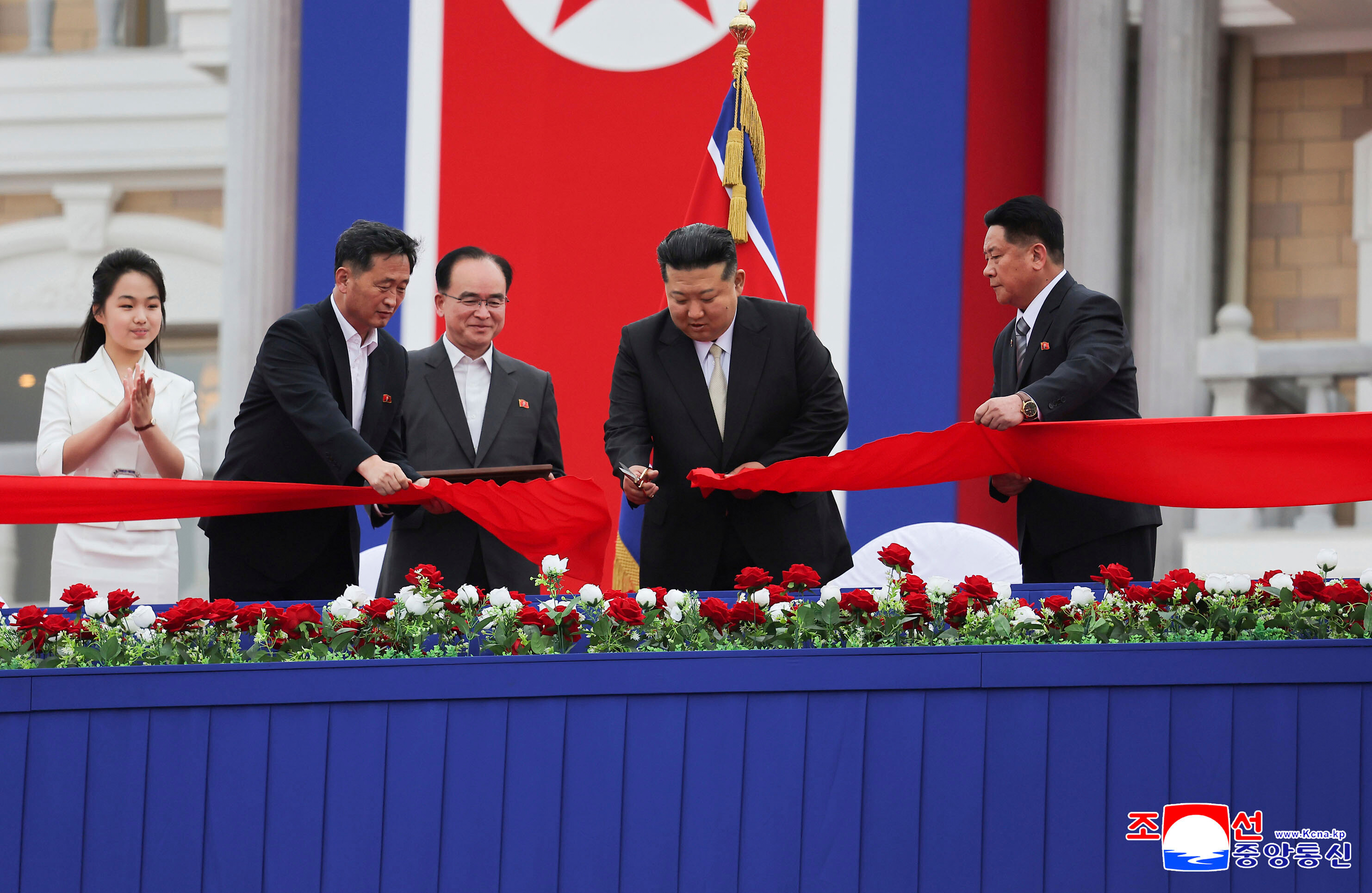 In this photo provided by the North Korean government, North Korean leader Kim Jong Un, second right, with his daughter, left, cuts the inaugural tape during a completion ceremony of the Wonsan-Kalma coastal tourist zone in North Korea Tuesday, June 24, 2025. Independent journalists were not given access to cover the event depicted in this image distributed by the North Korean government. The content of this image is as provided and cannot be independently verified. Korean language watermark on image as provided by source reads: "KCNA" which is the abbreviation for Korean Central News Agency. (Korean Central News Agency/Korea News Service via AP)