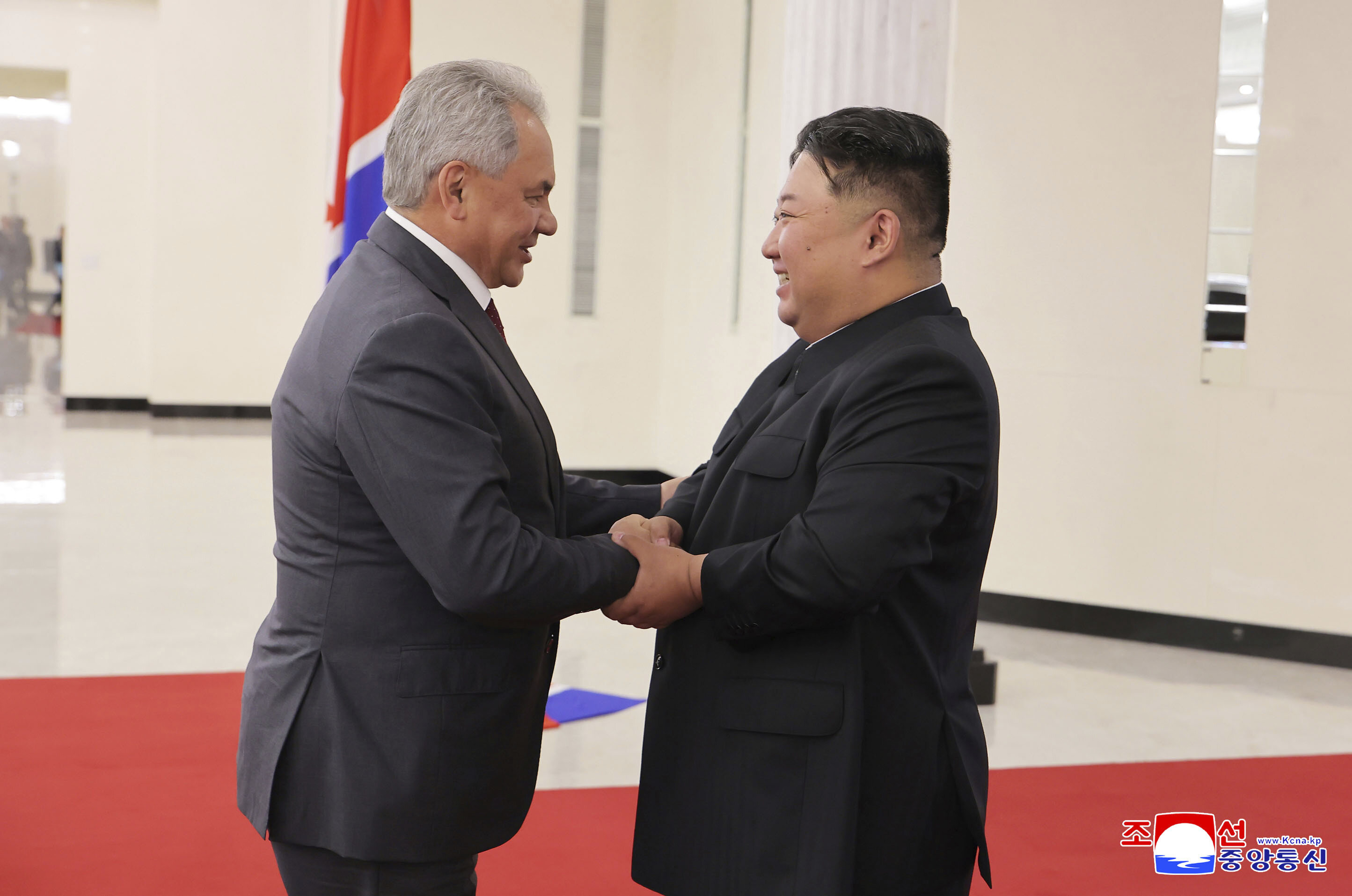 In this photo provided by the North Korean government, North Korean leader Kim Jong Un, right, shakes hands with Russian Security Council Secretary Sergei Shoigu, left, at the headquarters of the ruling Workers' Party in Pyongyang, North Korea, Tuesday, June 17, 2025. Independent journalists were not given access to cover the event depicted in this image distributed by the North Korean government. The content of this image is as provided and cannot be independently verified. Korean language watermark on image as provided by source reads: "KCNA" which is the abbreviation for Korean Central News Agency. (Korean Central News Agency/Korea News Service via AP)