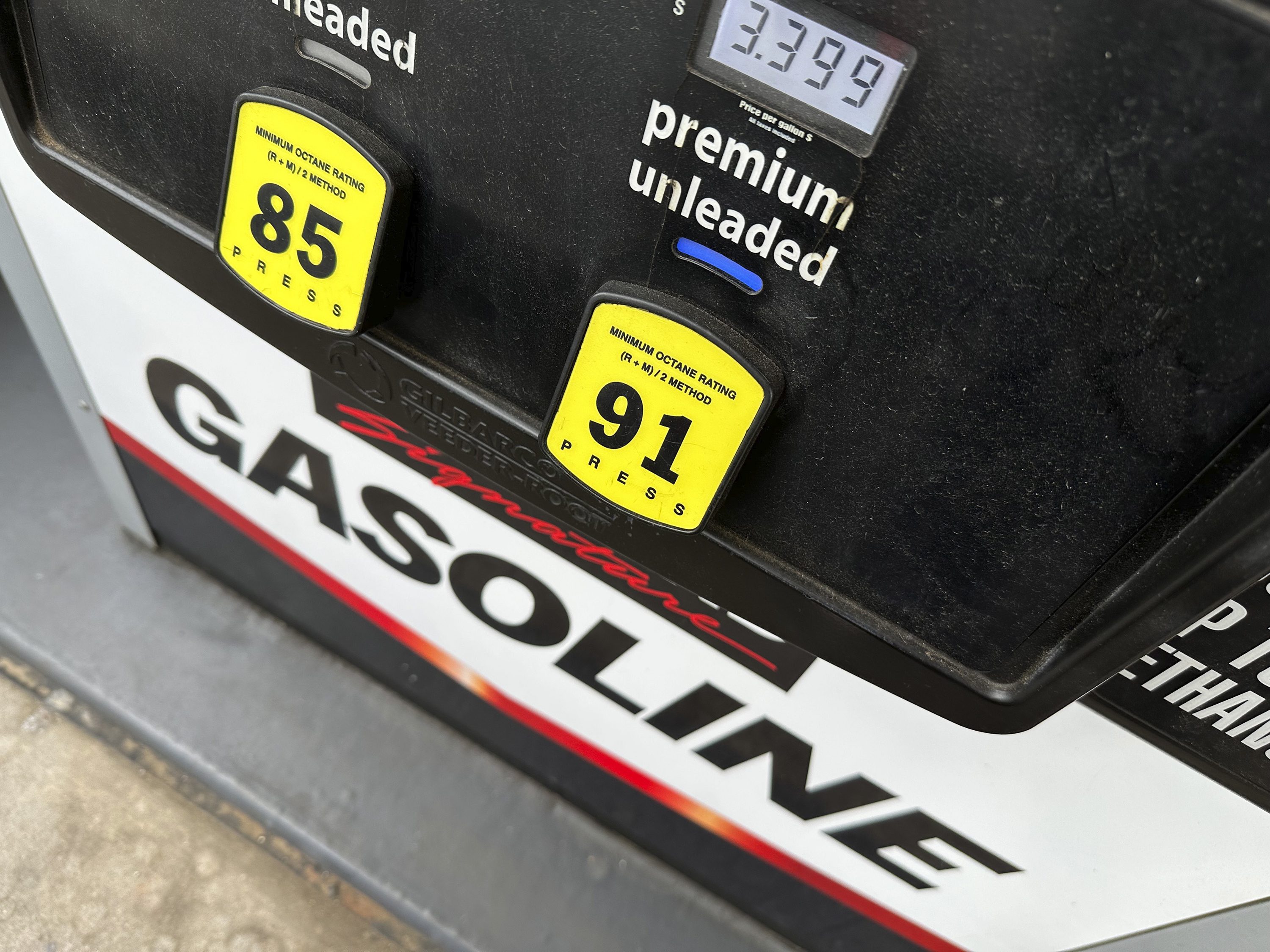 FILE - The per-gallon price is illuminated on the pump at a Costco warehouse gasoline station Tuesday, April 1, 2025, in Thornton, Colo. (AP Photo/David Zalubowski, File)
