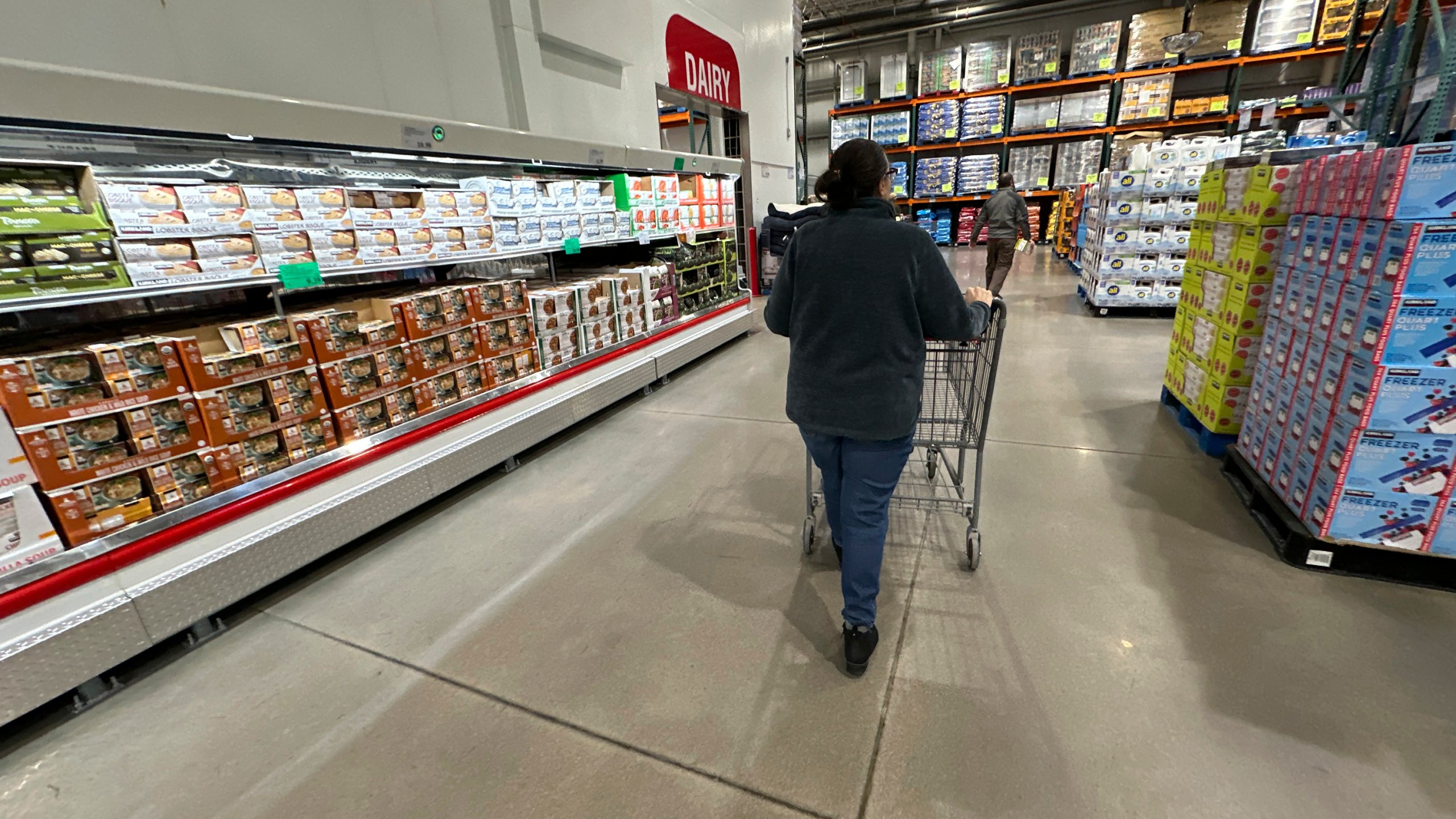 FILE - A shopper pushes a cart past a display of soups in a Costco warehouse Thursday, Jan. 23, 2025, in Sheridan, Colo. (AP Photo/David Zalubowski, File)