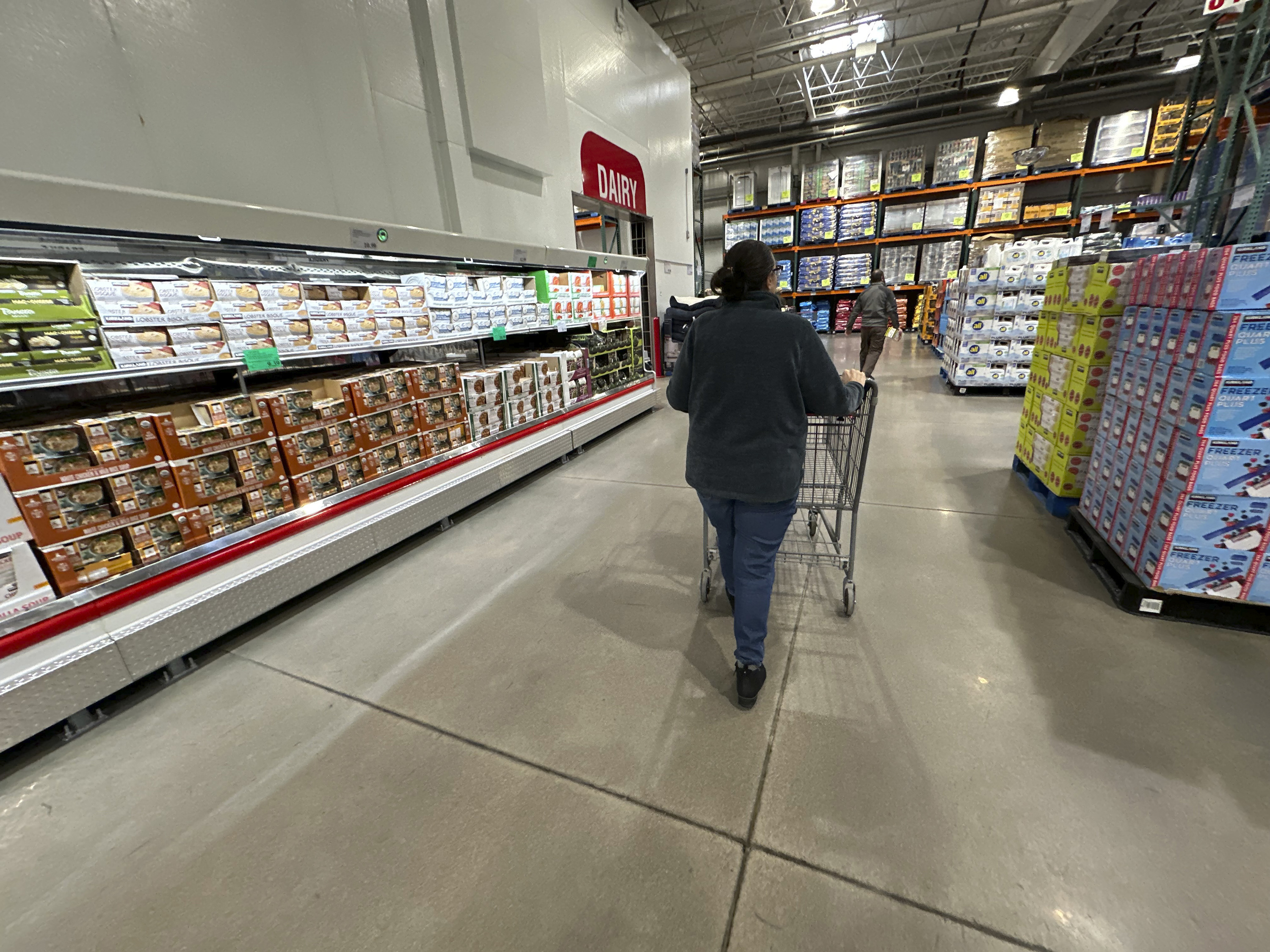 FILE - A shopper pushes a cart past a display of soups in a Costco warehouse Thursday, Jan. 23, 2025, in Sheridan, Colo. (AP Photo/David Zalubowski, File)