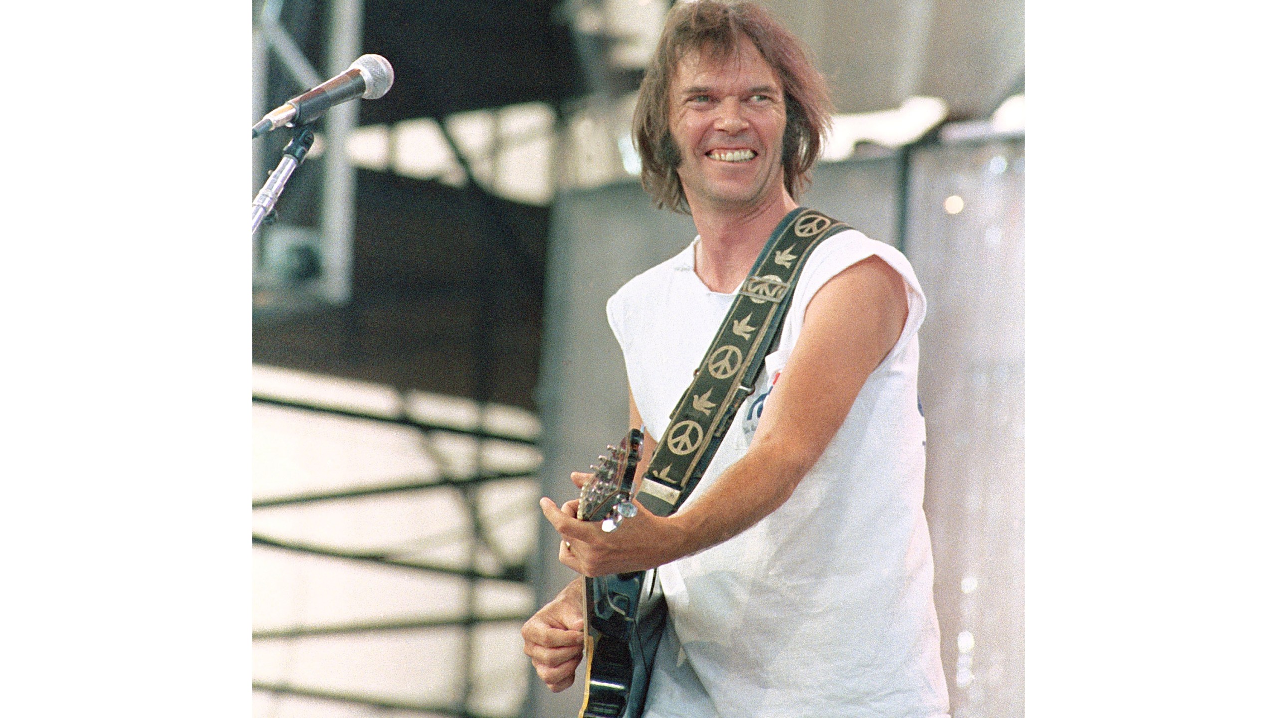 FILE - Neil Young performs during the Live Aid concert for famine relief at JFK Stadium in Philadelphia on July 13, 1985. (AP Photo/George Widman, File)