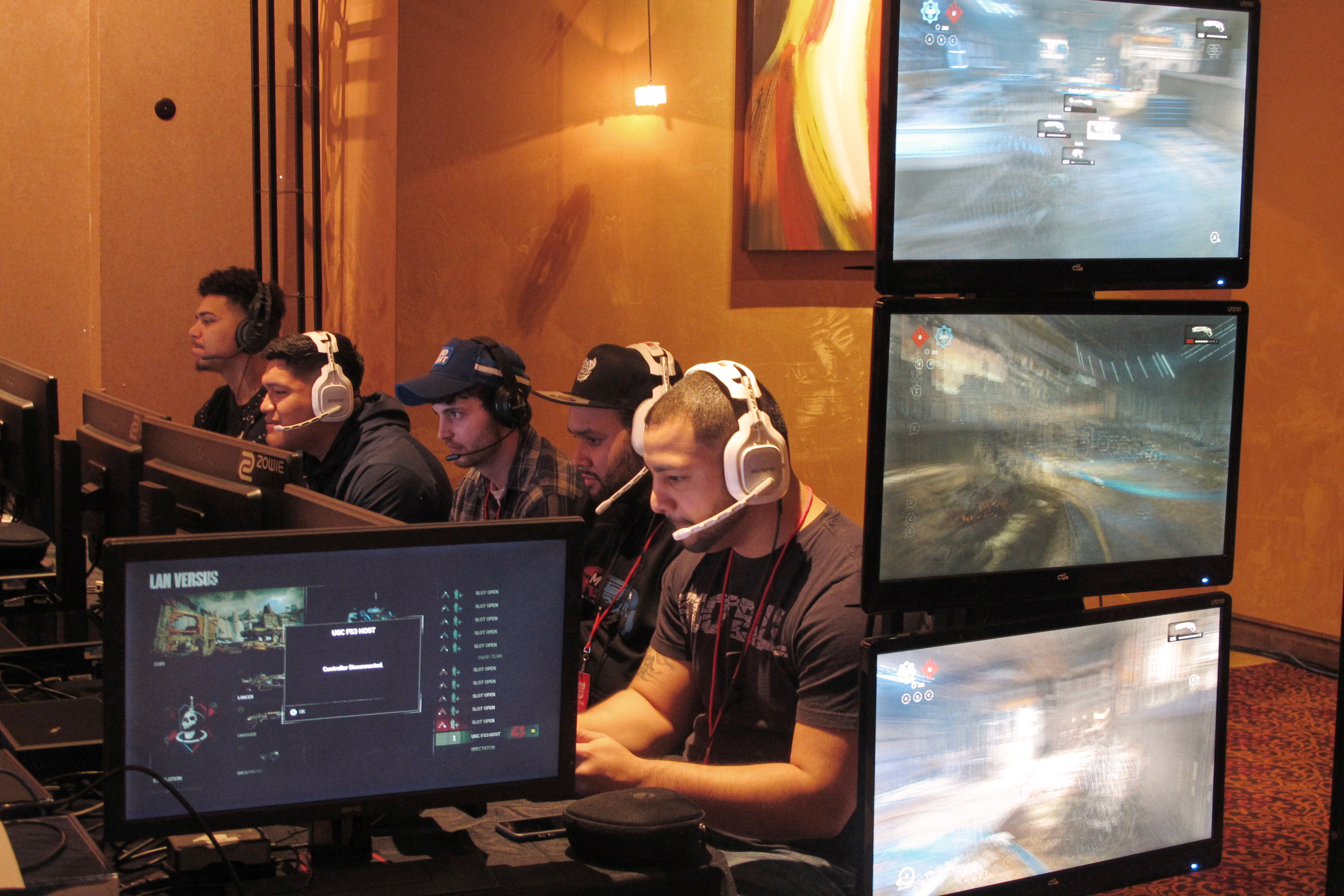FILE - Video game players compete in an esports tournament at Caesars casino in Atlantic City, N.J. on March 31, 2017. (AP Photo/Wayne Parry, File)