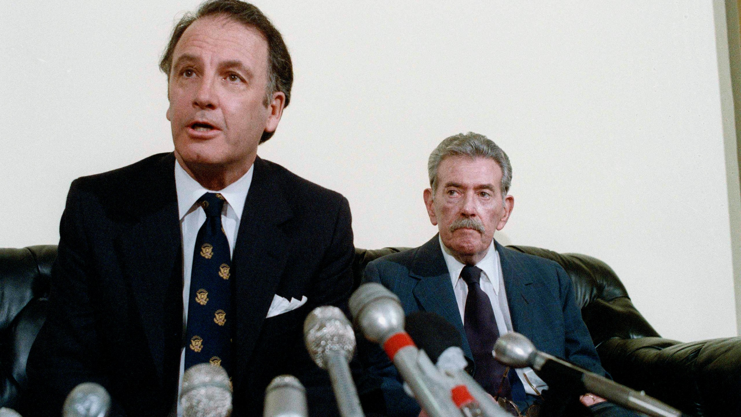 FILE - U.S. Rep. Pat Williams, (D-Mont), left, fields questions while seated next to Col. Murray Sanders during a news conference on Japanese World War II germ warfare experiments on American POW's on Capitol Hill in Washington, Dec. 6, 1985. (AP Photo/John Duricka, File)