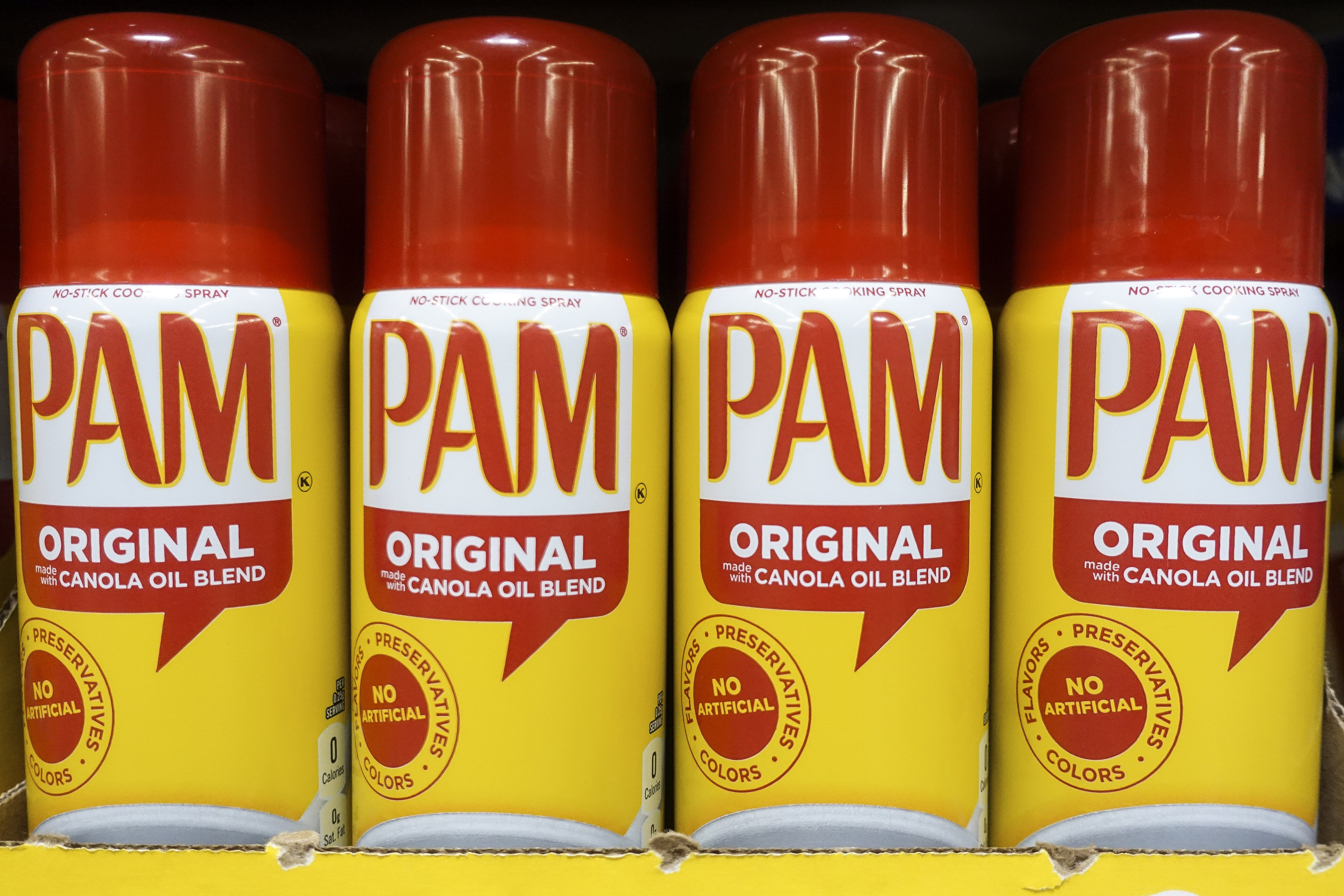 FILE - Cans of PAM cooking spray, a Conagra brand, rest on a supermarket shelf in Cincinnati, June 25, 2019. (AP Photo/John Minchillo, File)