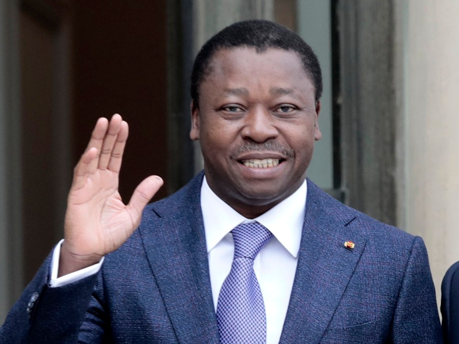 FILE - Togo's President Faure Gnassingbe waves before a working lunch at the Elysee Palace in Paris on April 9, 2021. (AP Photo/Lewis Joly, File)