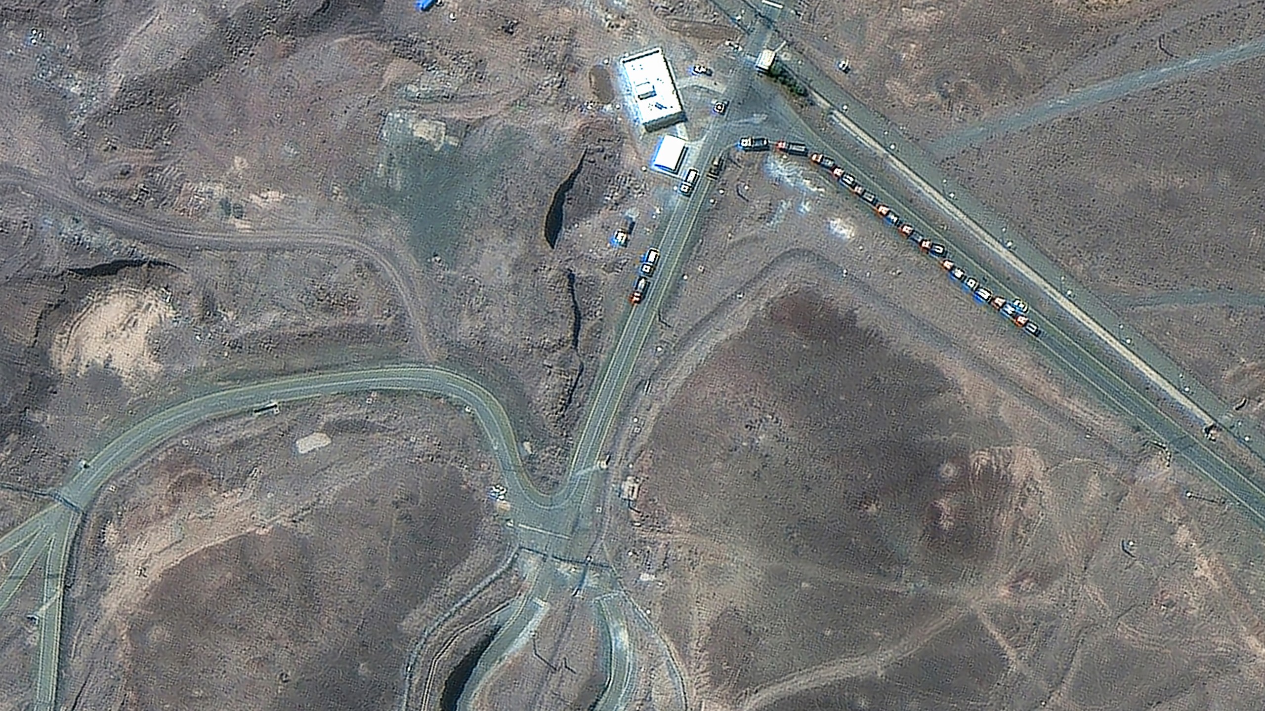This satellite image provided by Maxar Technologies shows vehicles at the Fordo enrichment facility in Iran on June 19, 2025. (Maxar Technologies via AP)