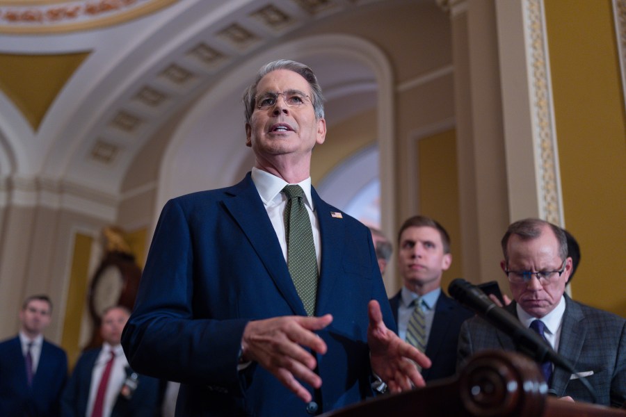 Treasury Secretary Scott Bessent talks to reporters about his lunch meeting with Republican senators and the schedule for getting the Republican megabill to President Donald Trump's desk by July 4, at the Capitol in Washington, Tuesday, June 24, 2025. (AP Photo/J. Scott Applewhite)