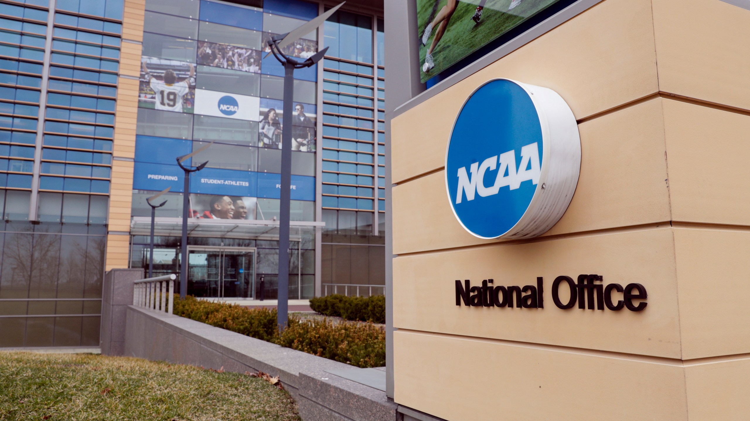 FILE - The national office of the NCAA in Indianapolis is shown on March 12, 2020. (AP Photo/Michael Conroy, File)