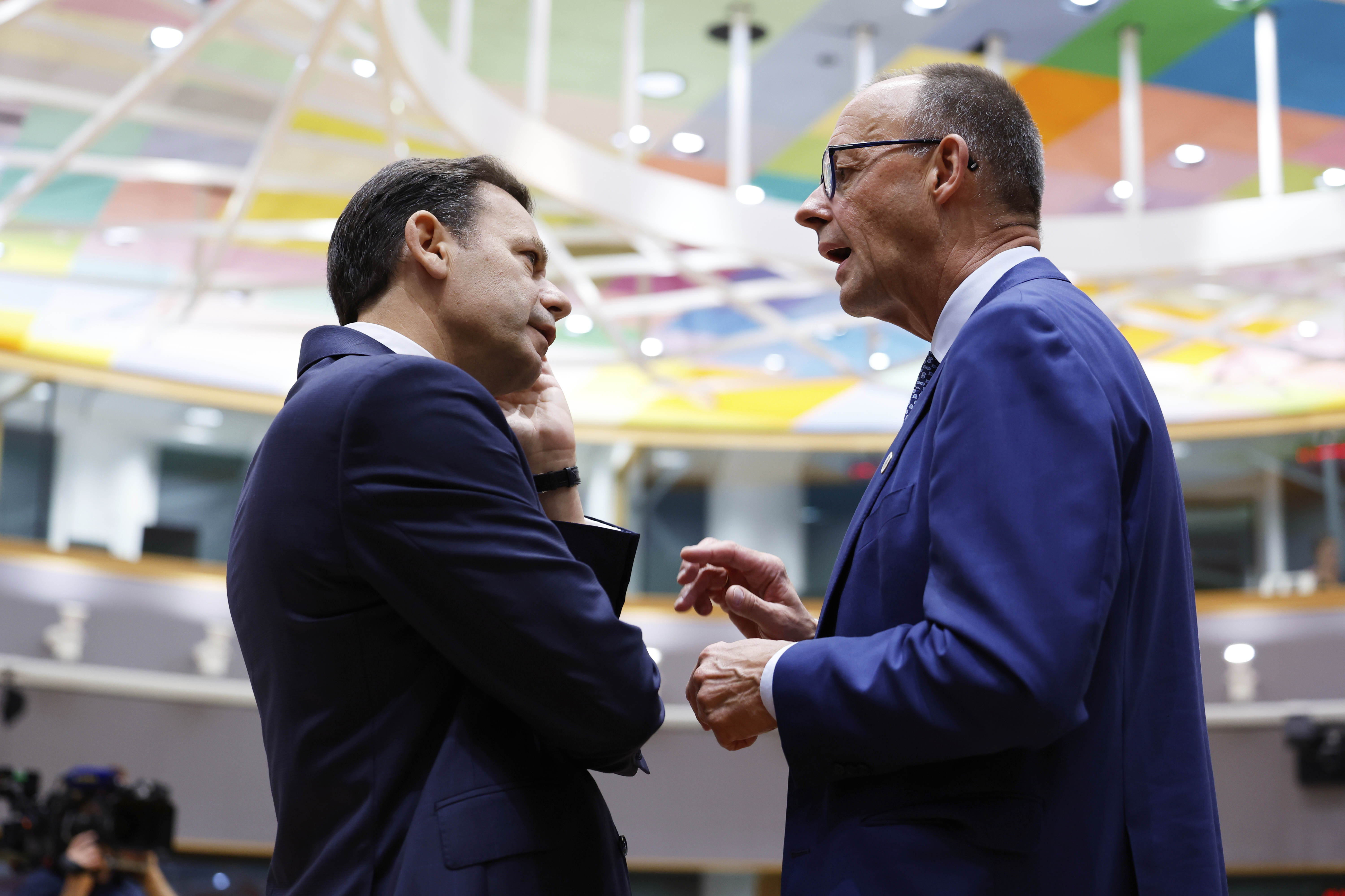 Germany's Chancellor Friedrich Merz, right, speaks with Portugal's Prime Minister Luis Montenegro during a round table meeting at an EU summit in Brussels, Thursday, June 26, 2025. (AP Photo/Geert Vanden Wijngaert)