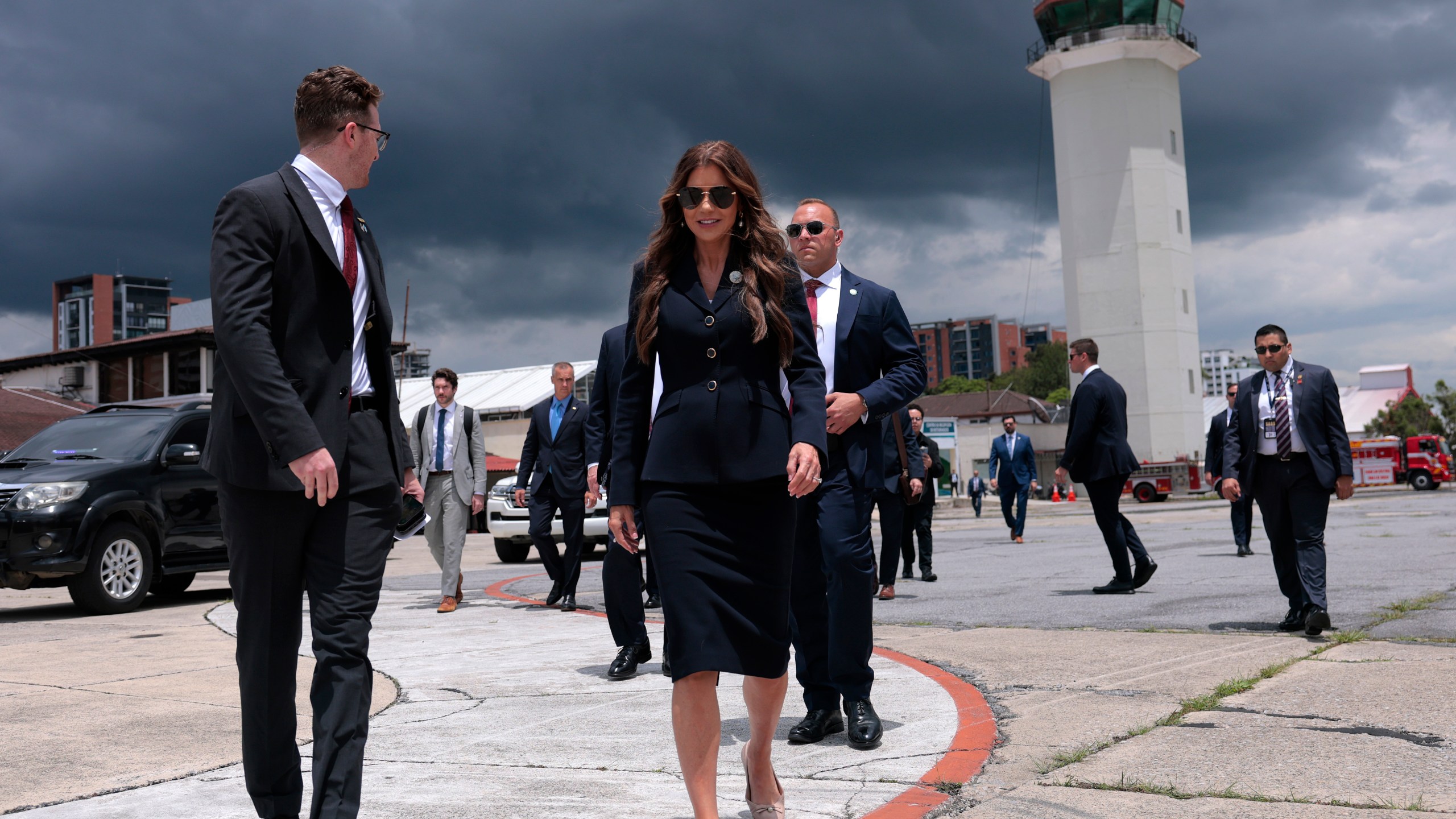 U.S. Homeland Security Secretary Kristi Noem walks to a waiting plane after touring the Department of Homeland Security operations at La Aurora International Airport, in Guatemala City, Thursday, June 26, 2025. (Anna Moneymaker/Pool Photo via AP)