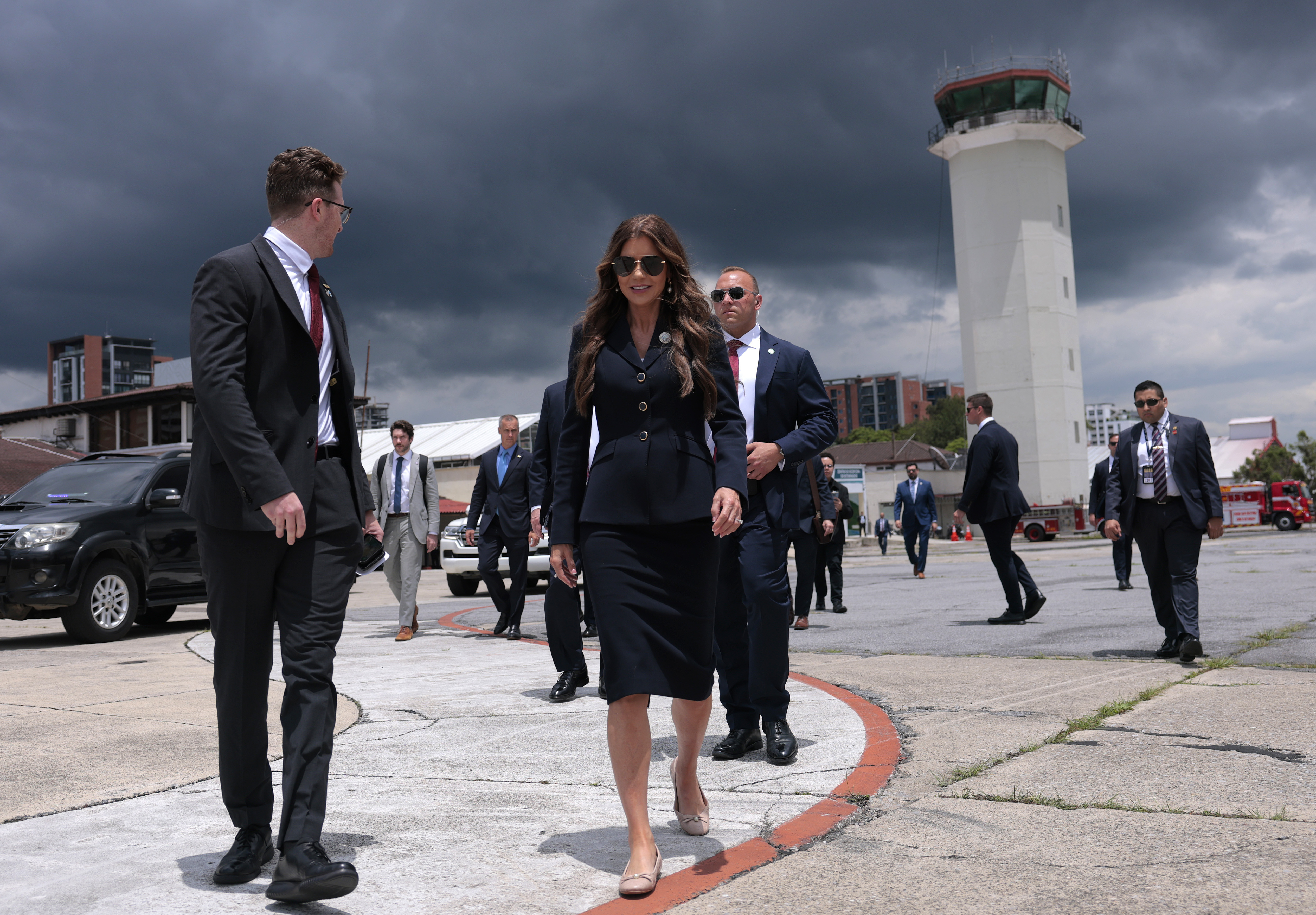 U.S. Homeland Security Secretary Kristi Noem walks to a waiting plane after touring the Department of Homeland Security operations at La Aurora International Airport, in Guatemala City, Thursday, June 26, 2025. (Anna Moneymaker/Pool Photo via AP)