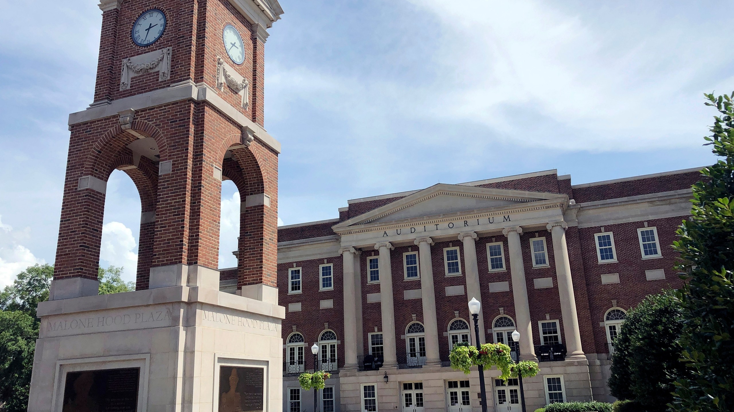 FILE - The Autherine Lucy Clock Tower at the Malone Hood Plaza stands in front of Foster Auditorium on the University of Alabama campus in Tuscaloosa, Ala., June 16, 2019. (AP Photo/Bill Sikes, File)